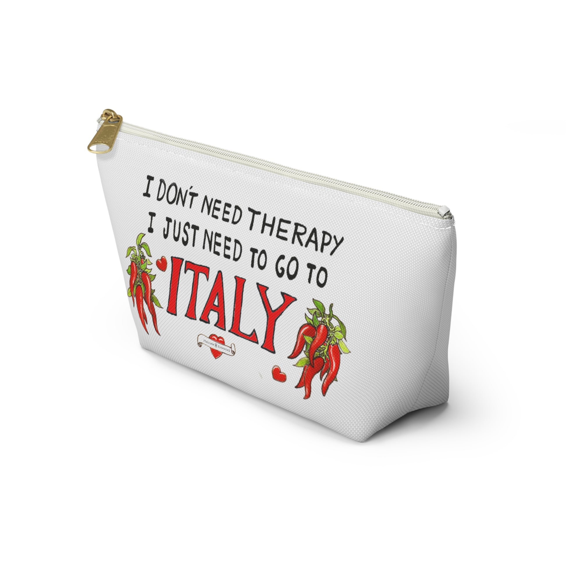 Italy inspired white canvas clutch with the quote I don't need therapy, I just need to go to Italy. The quote is in handwritten with the word Italy in red. On both sides of Italy there are bundles of peppers. The clutch has a black zipper that fits with the black text. Designed by Italian Summers