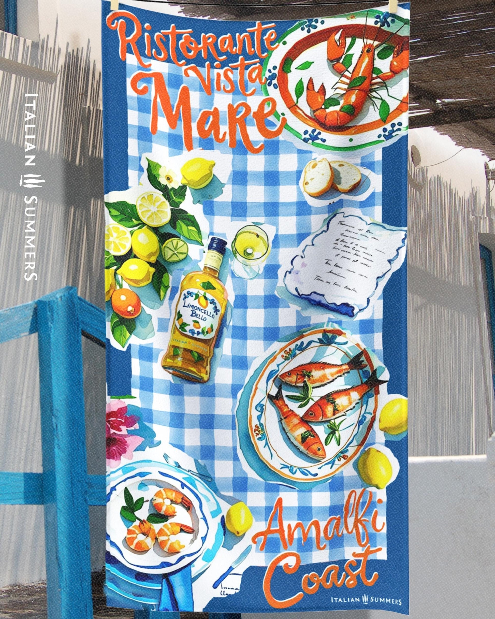 A beach towel featuring a blue rim with blue and white checkered patterns, hand-painted cut-out illustrations of Italian seafood, lemons, and limoncello, with the texts “Ristorante Vista Mare” on top and “Amalfi Coast” on the bottom, evoking an authentic Italian seaside trattoria vibe