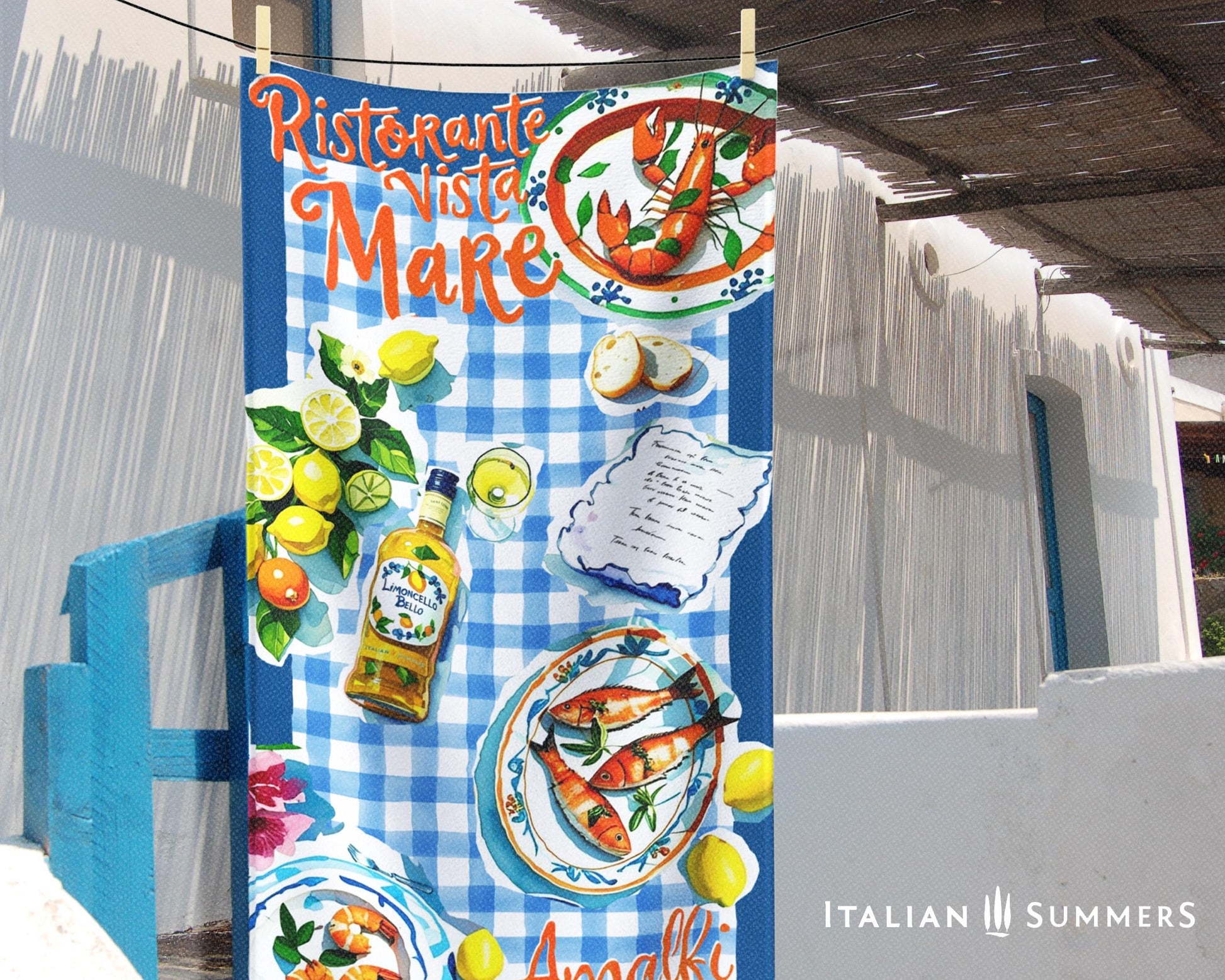 A beach towel featuring a blue rim with blue and white checkered patterns, hand-painted cut-out illustrations of Italian seafood, lemons, and limoncello, with the texts “Ristorante Vista Mare” on top and “Amalfi Coast” on the bottom, evoking an authentic Italian seaside trattoria vibe