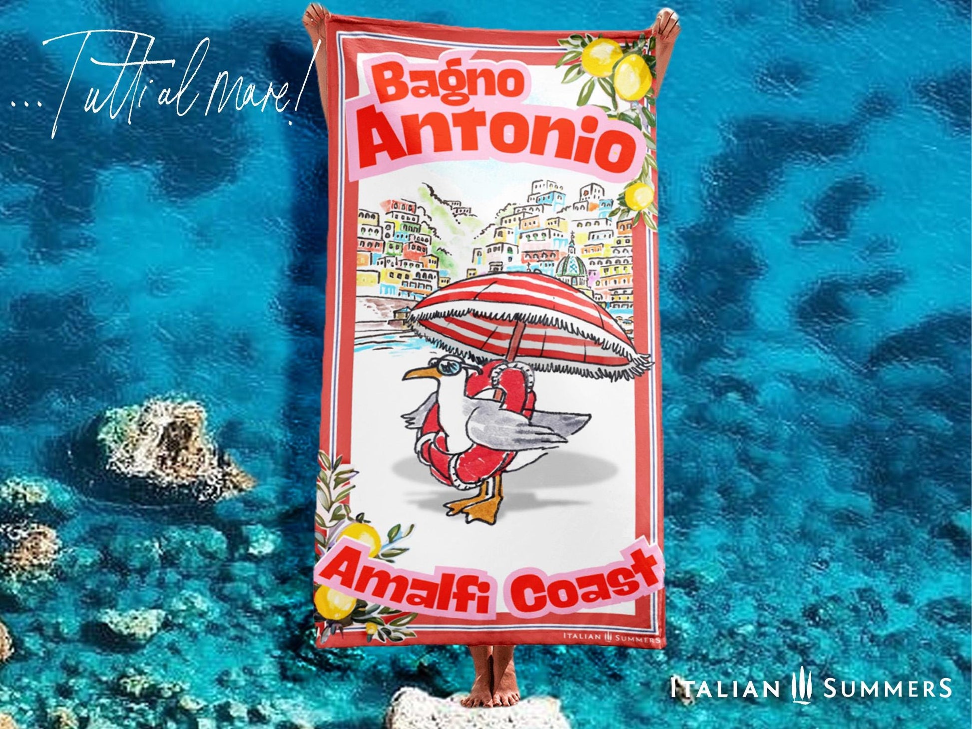 Illustrated Amalfi Coast beach towel featuring a funny seagull wearing sunglasses and a life saver while standing under a striped beach umbrella, Positano in the background, and vintage lemon borders with the text Bagno Antonio and Amalfi Coast Designed by Italian Summers