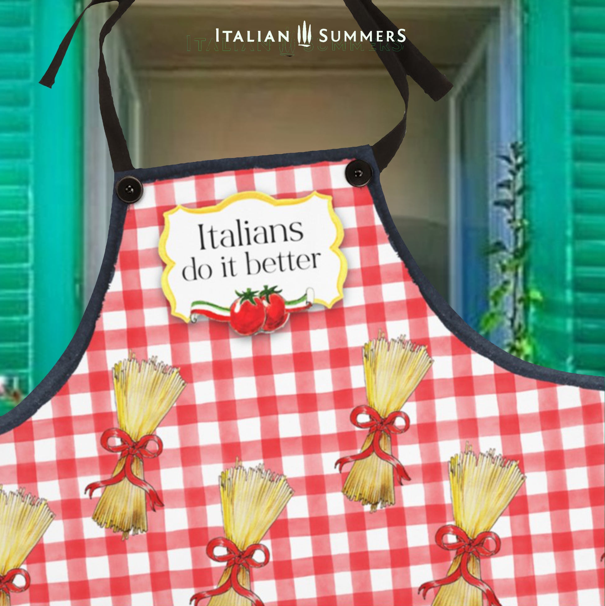 A happy red-checkered printed pattern apron with bundles of spaghetti with red bows . On the chest is a yellow  gold frame with the text: Italians do it better, and two happy tomatoes with an Italian  flag