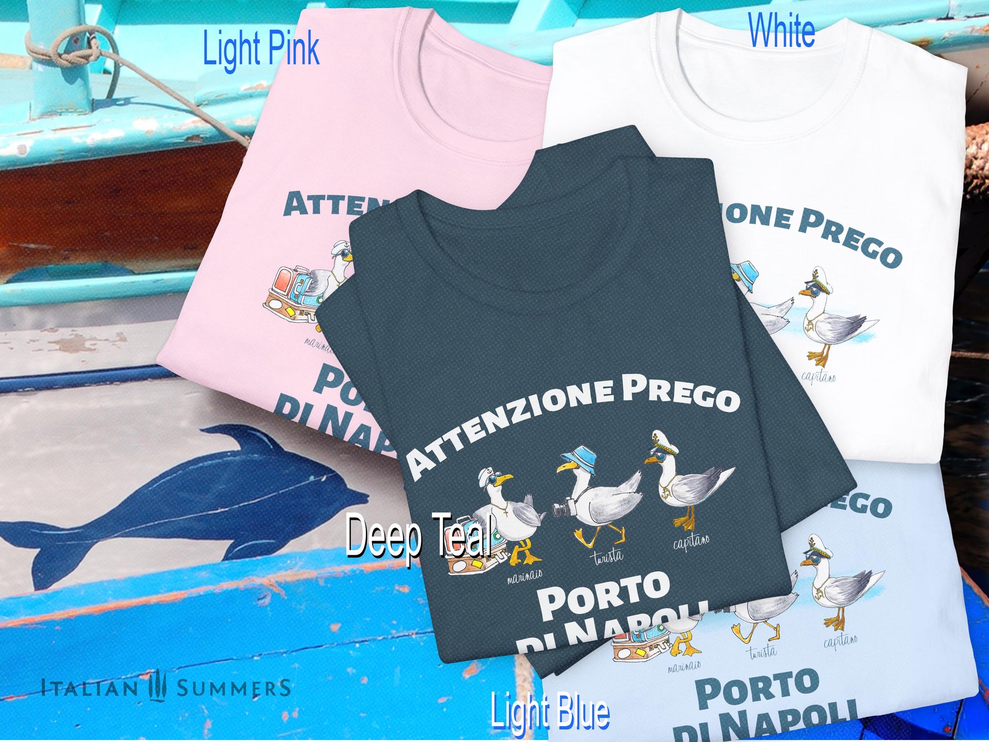 A cotton T-Shirt with the Italian text PORTO di NAPOLI in blue block letters and featuring the hand-drawn sketches of  three seagulls dressed up as a sailor, a tourist, and a boat captain.