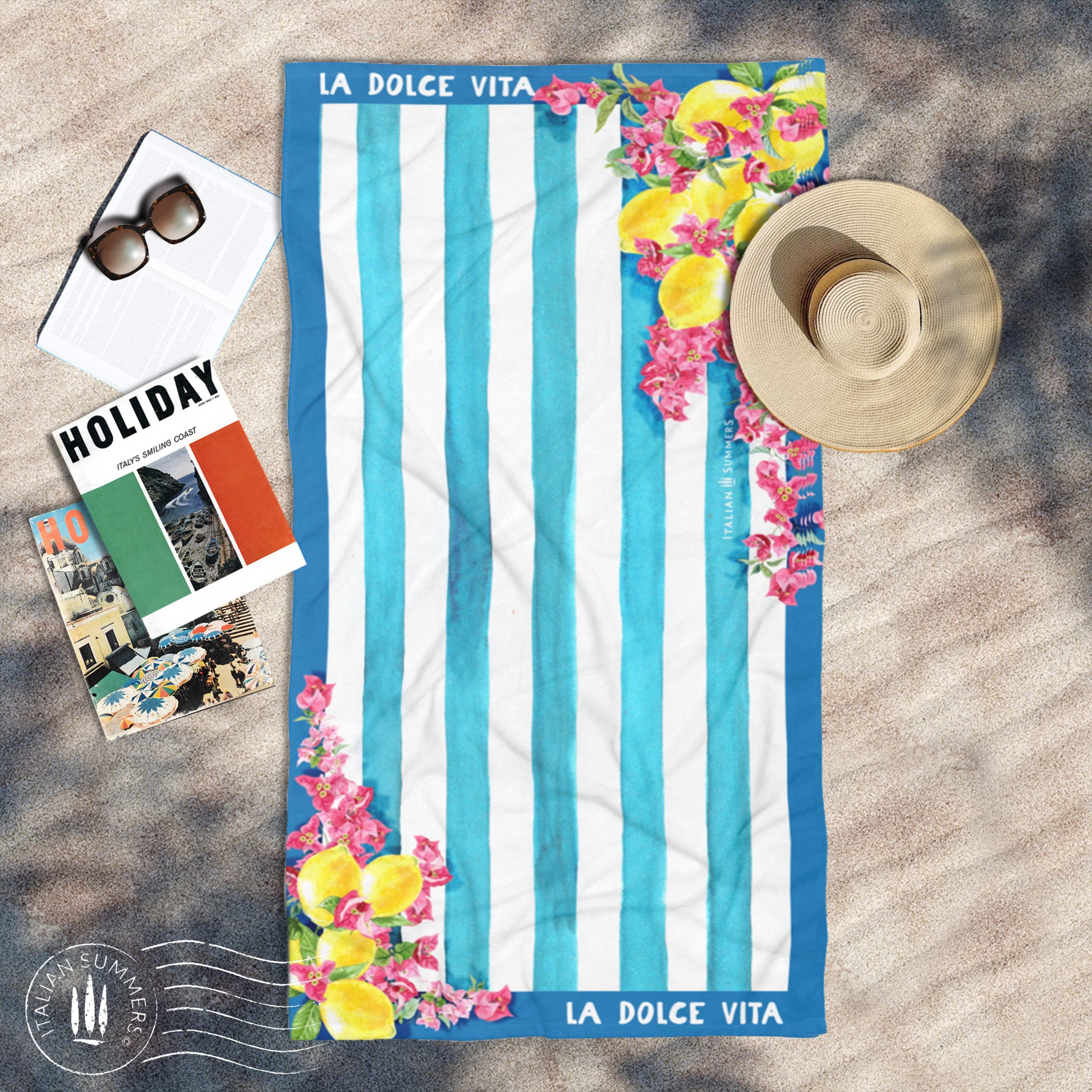 Italy inspired beach towel with a retro design from the 1950s featuring blue and white stripes, bouganvilleas and Sorrento lemons as well as the quote of " La Dolce Vita". Made by Italian Summers