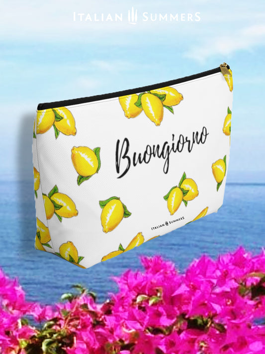 clutch BUONGIORNO LIMONI. Inspired by the sunny, Mediterranean vibes of Italy, this clutch is decorated with playful, happy Sorrento lemons and the classic Italian greeting of "Buongiorno".