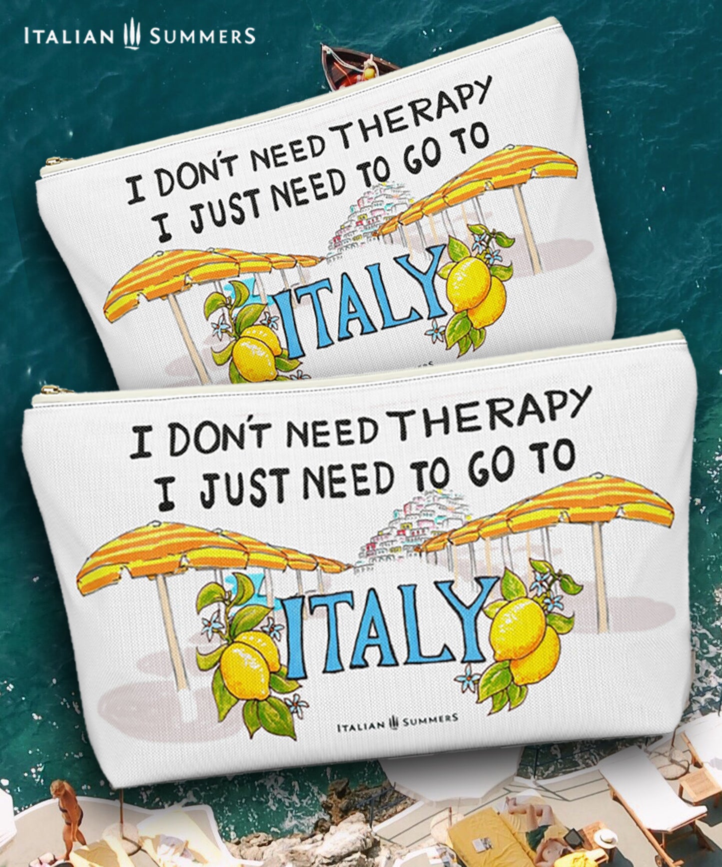 Italy inspired clutch of white canvas with he quote I don't need therapy, I just need to go to Italy. On the clutch there is a sketch of the beach umbrellas on Positano beach The beach umbrellas are yellow and orange striped. In the distance you ccan see the stagered houses of Positano. The word Italy in in big blue letters and is flancked with lemons. Designed by Italian Summers.