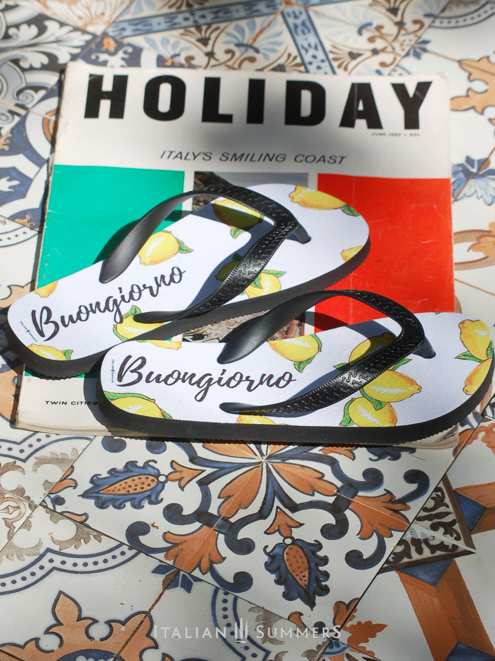 Slip into a pair of Buongiorno Limoni flip flops for a taste of Italy's sunny charm. Our stylish lemon-decorated flip flops bring the dolce vita to your next alfresco affair. Made by Italian Summers