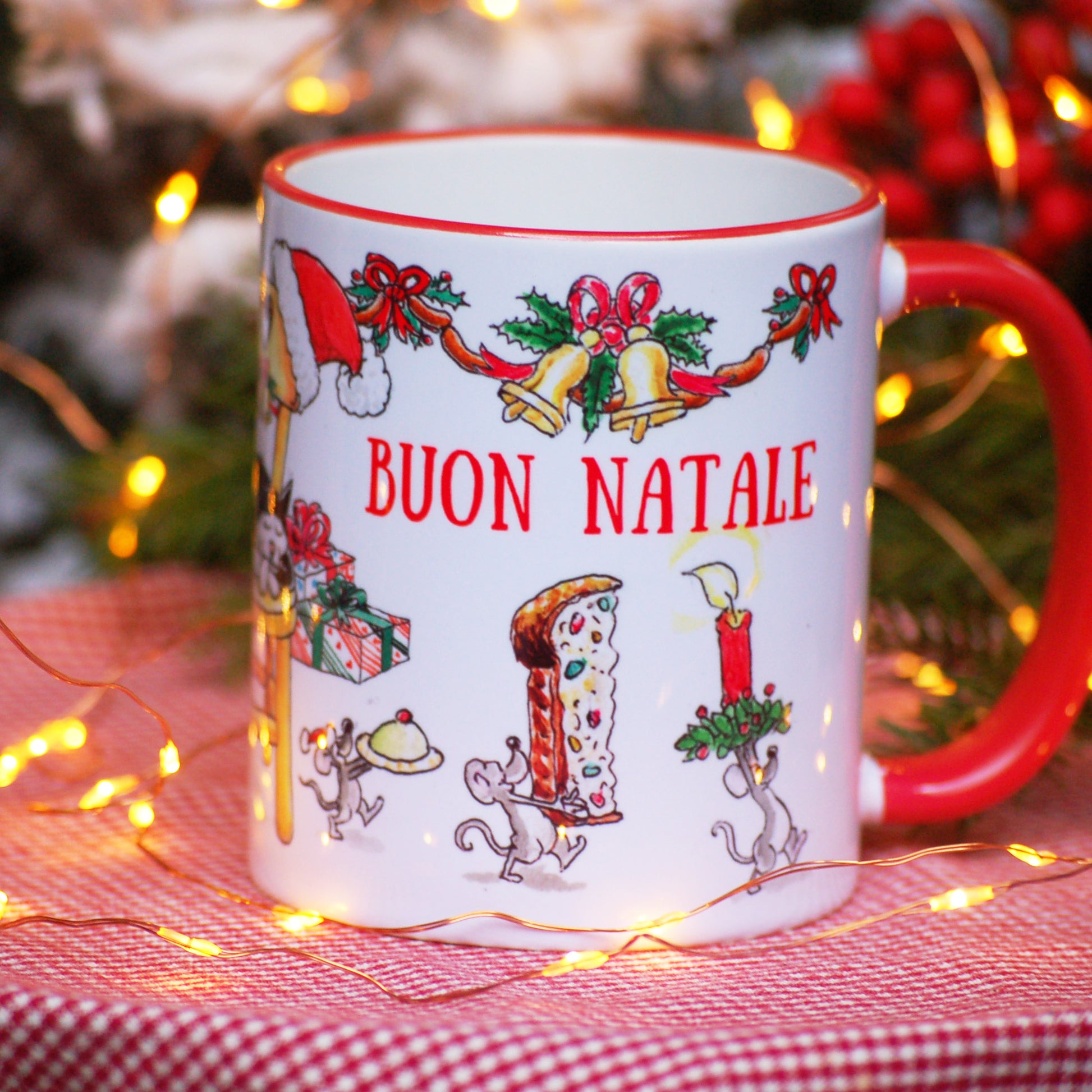 Holiday coffee cup featuring cat on chair and mice stealing food
