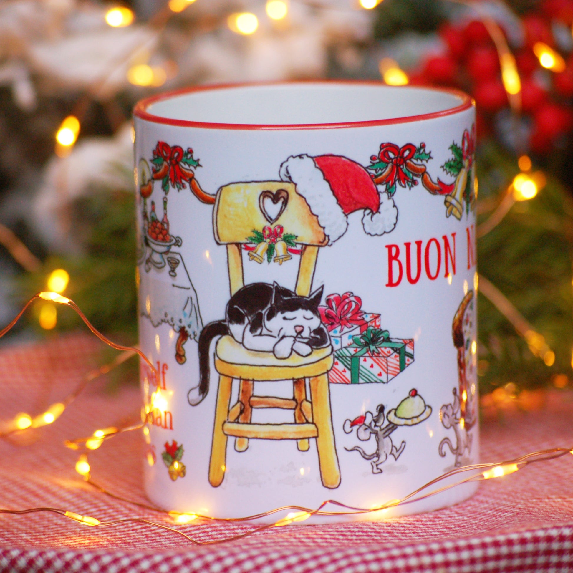Holiday coffee cup featuring cat on chair and mice stealing food
