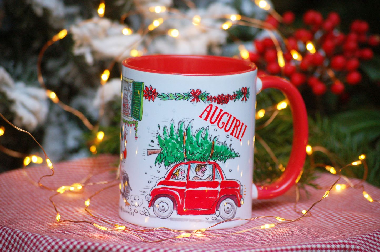 This Italy-inspired ceramic Christmas mug features the print of a merry trio of Italian cats singing carols on a vintage Vespa as they speed through an Italian street. A cute vintage red Fiat500 car zooms in the opposite direction with a Christmas tree on the roof!