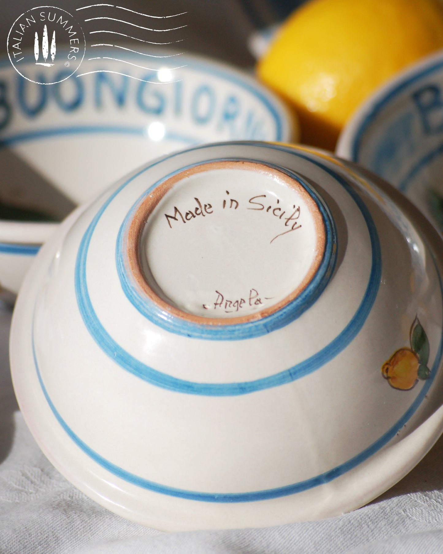 Italian ceramic lemon bowls with the text Buongiorno. The Amalfi coast lemons are hand painted on the inside of the bowl and the word Buongiorno is on the inside on the top of the rim. By Italian Summers