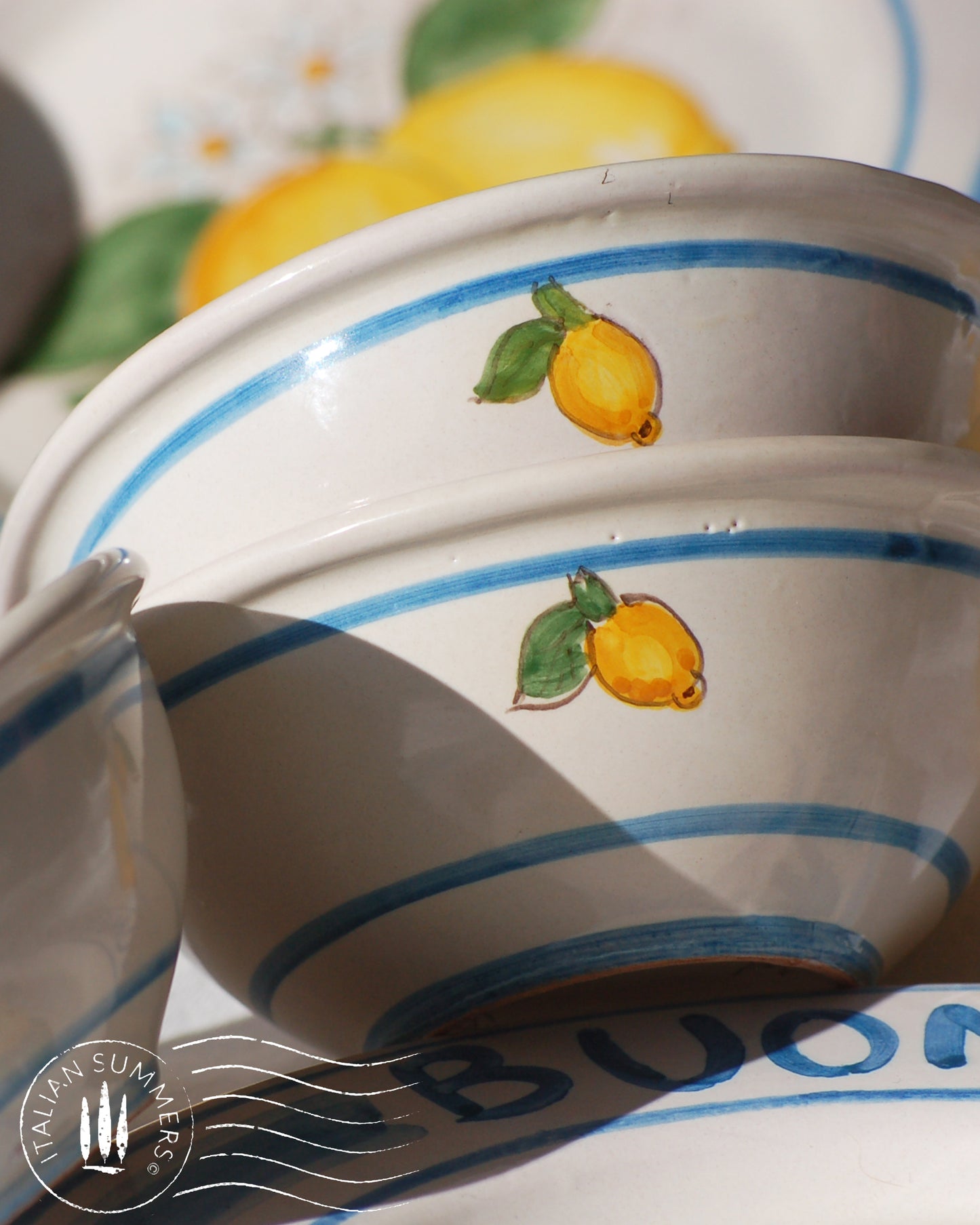 Italian ceramic lemon bowls with the text Buongiorno. The Amalfi coast lemons are hand painted on the inside of the bowl and the word Buongiorno is on the inside on the top of the rim. By Italian Summers