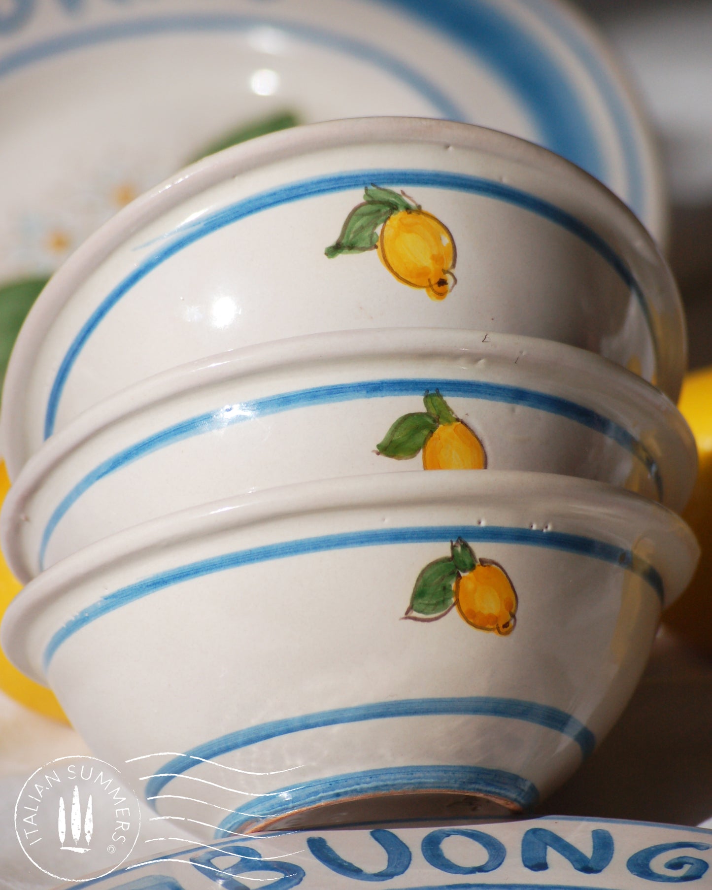 Italian ceramic lemon bowls with the text Buongiorno. The Amalfi coast lemons are hand painted on the inside of the bowl and the word Buongiorno is on the inside on the top of the rim. By Italian Summers