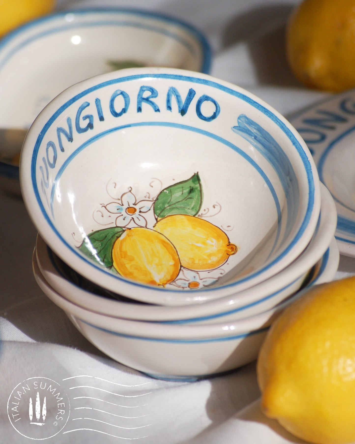 Italian ceramic lemon bowls with the text Buongiorno. The Amalfi coast lemons are hand painted on the inside of the bowl and the word Buongiorno is on the inside on the top of the rim. By Italian Summers