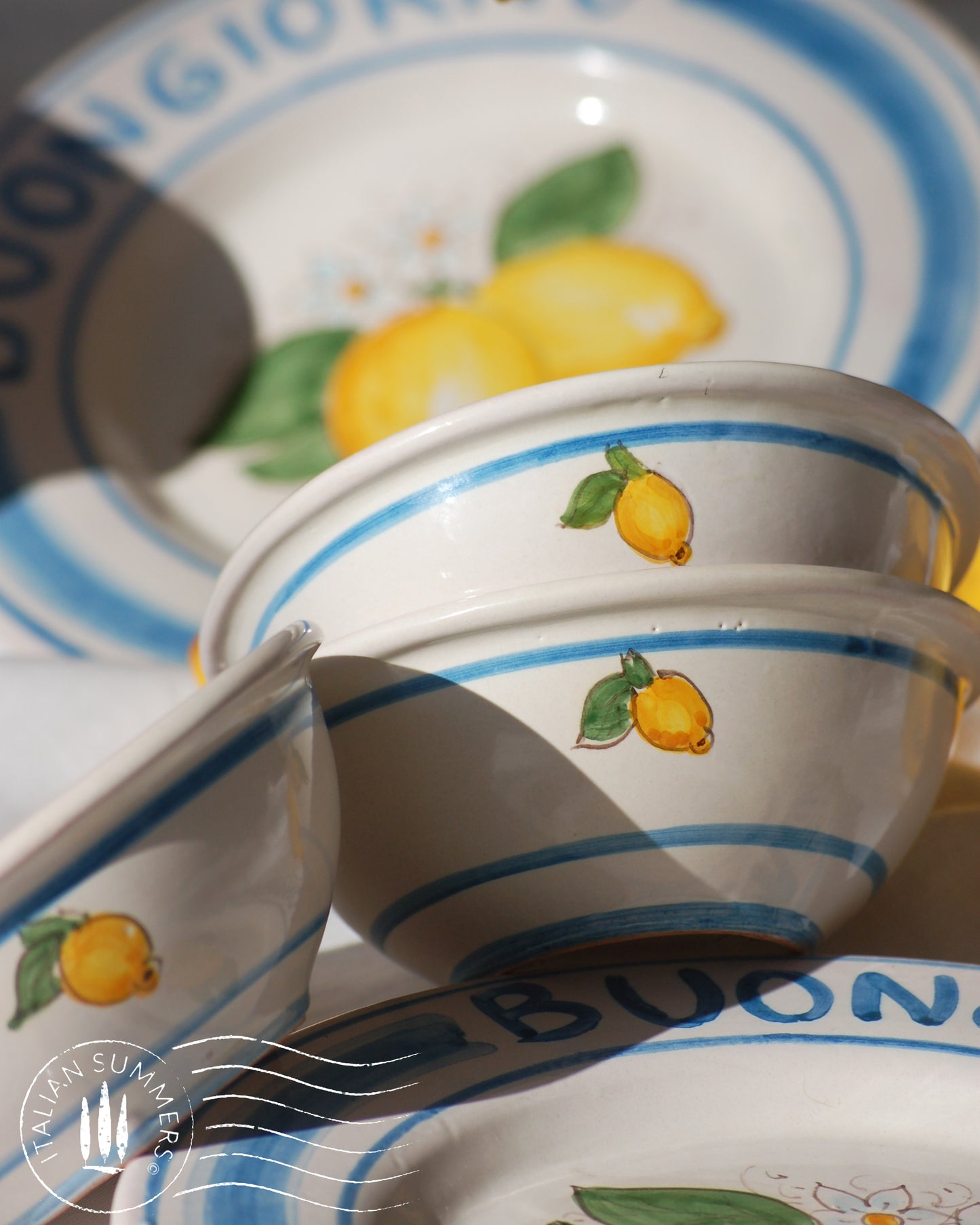 Italian ceramic lemon bowls with the text Buongiorno. The Amalfi coast lemons are hand painted on the inside of the bowl and the word Buongiorno is on the inside on the top of the rim. By Italian Summers