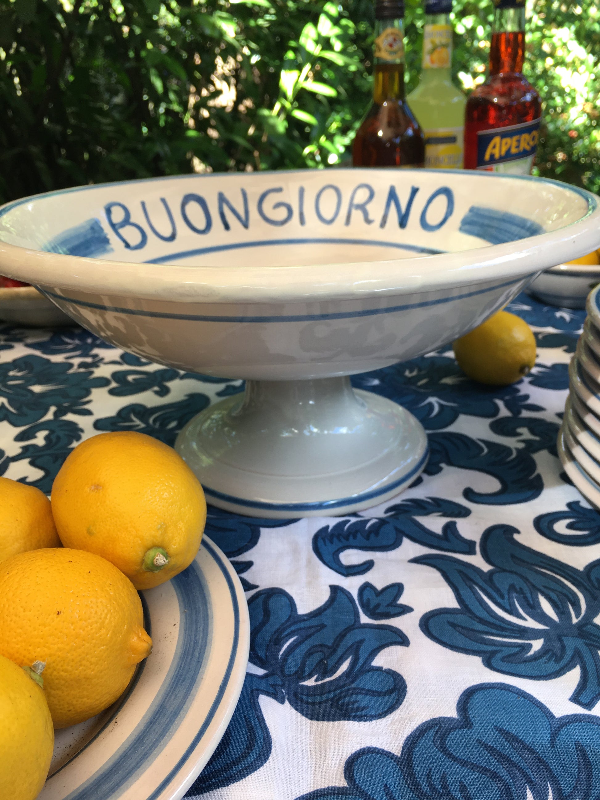 Italian ceramic fruit stand  with amalfi Coast lemons and the word Buongiorno on the rim on the inside. Handpinted in sicily by Italian Summers