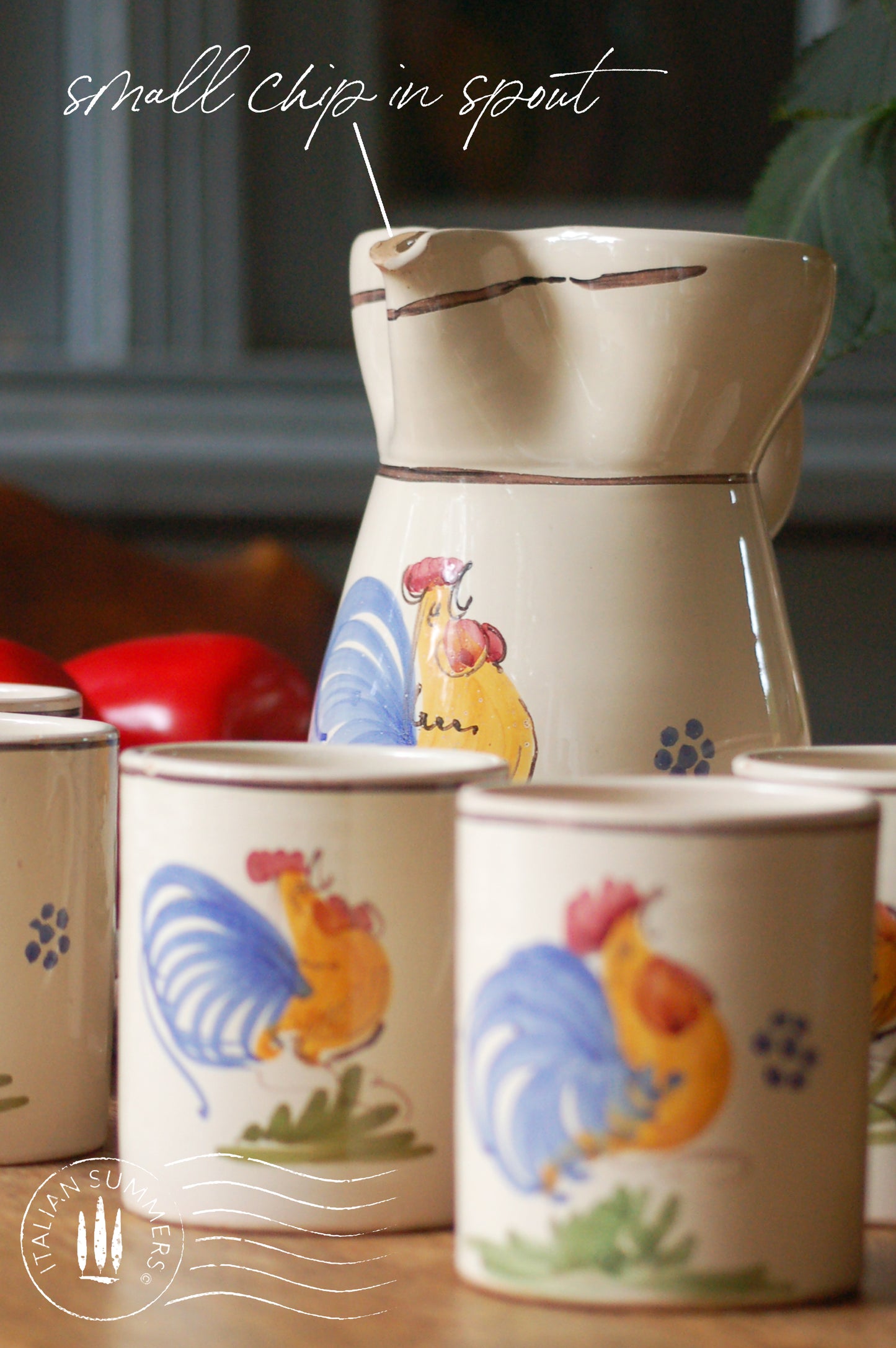 A set of Vintage maiolica ceramic six mugs and a carafe from Puglia, Italy. Each mug as well as the carafe are glazed with the traditional creamy white Grottaglie glaze, decorated with a hand-painted colorful rooster, symbol of good luck and prosperity.