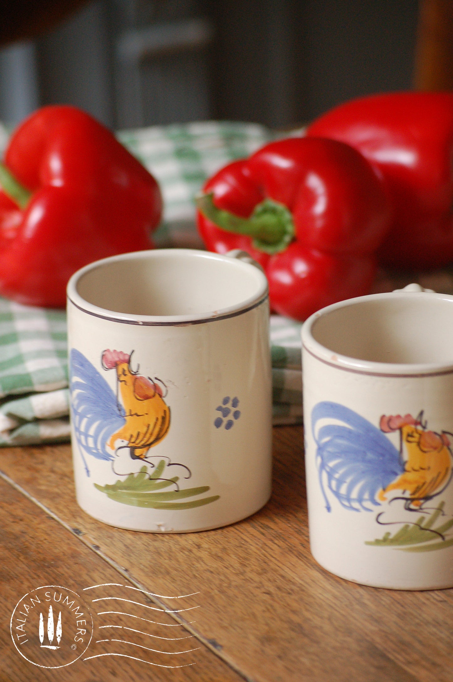 A set of Vintage maiolica ceramic six mugs and a carafe from Puglia, Italy. Each mug as well as the carafe are glazed with the traditional creamy white Grottaglie glaze, decorated with a hand-painted colorful rooster, symbol of good luck and prosperity.