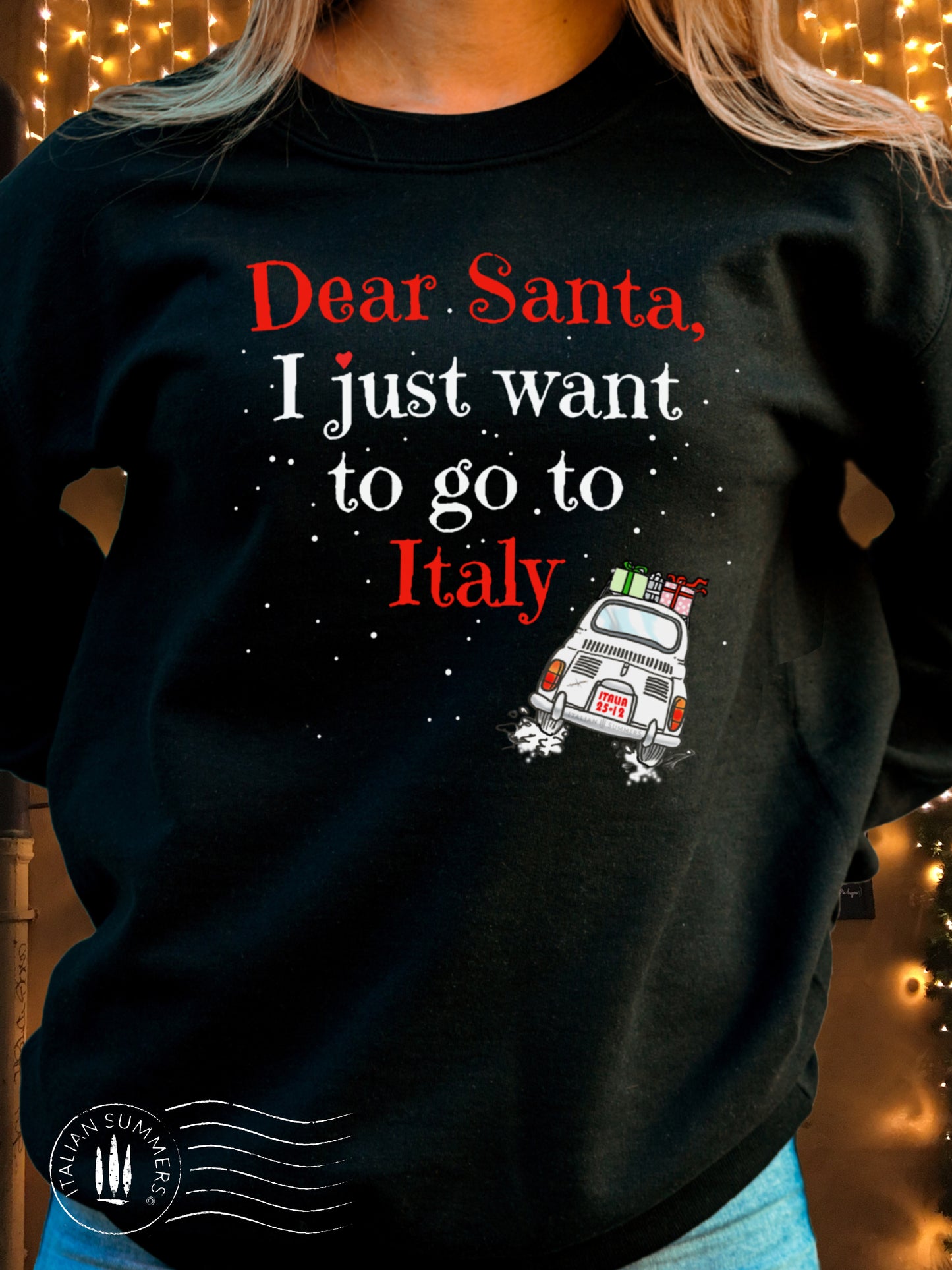 A soft, comfy and cozy Italy-Christmas inspired sweatshirt. It features the fun phrase: "Dear Santa, I just want to go to Italy", and a vintage Fiat 500 speeding away loaded with wrapped Christmas gifts: Buon Natale!
