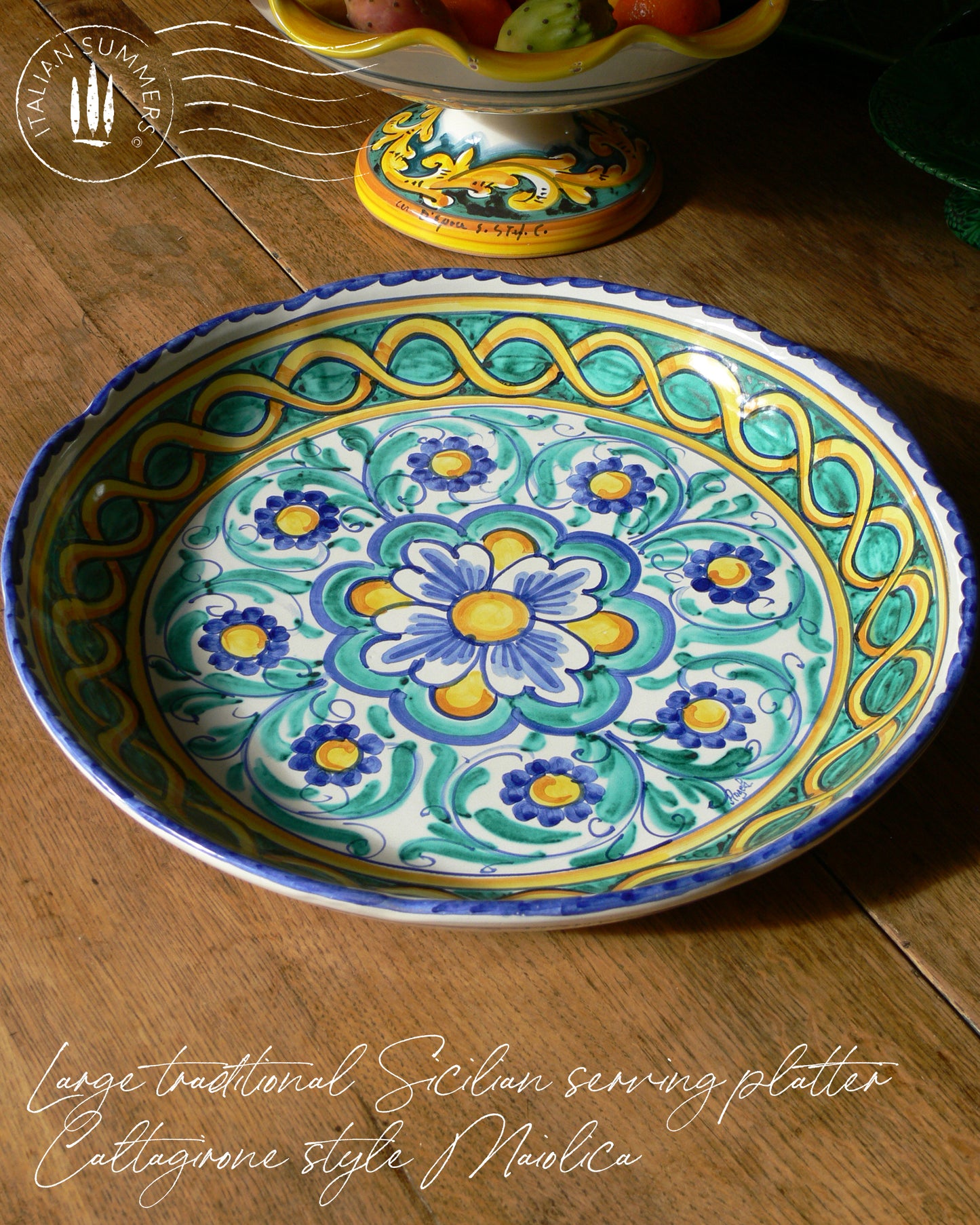 A large Siciian Maiolica ceramic platter decorated with rich traditional turquoise and cobalt and yellow glazed colors in the traditional Caltagirone style