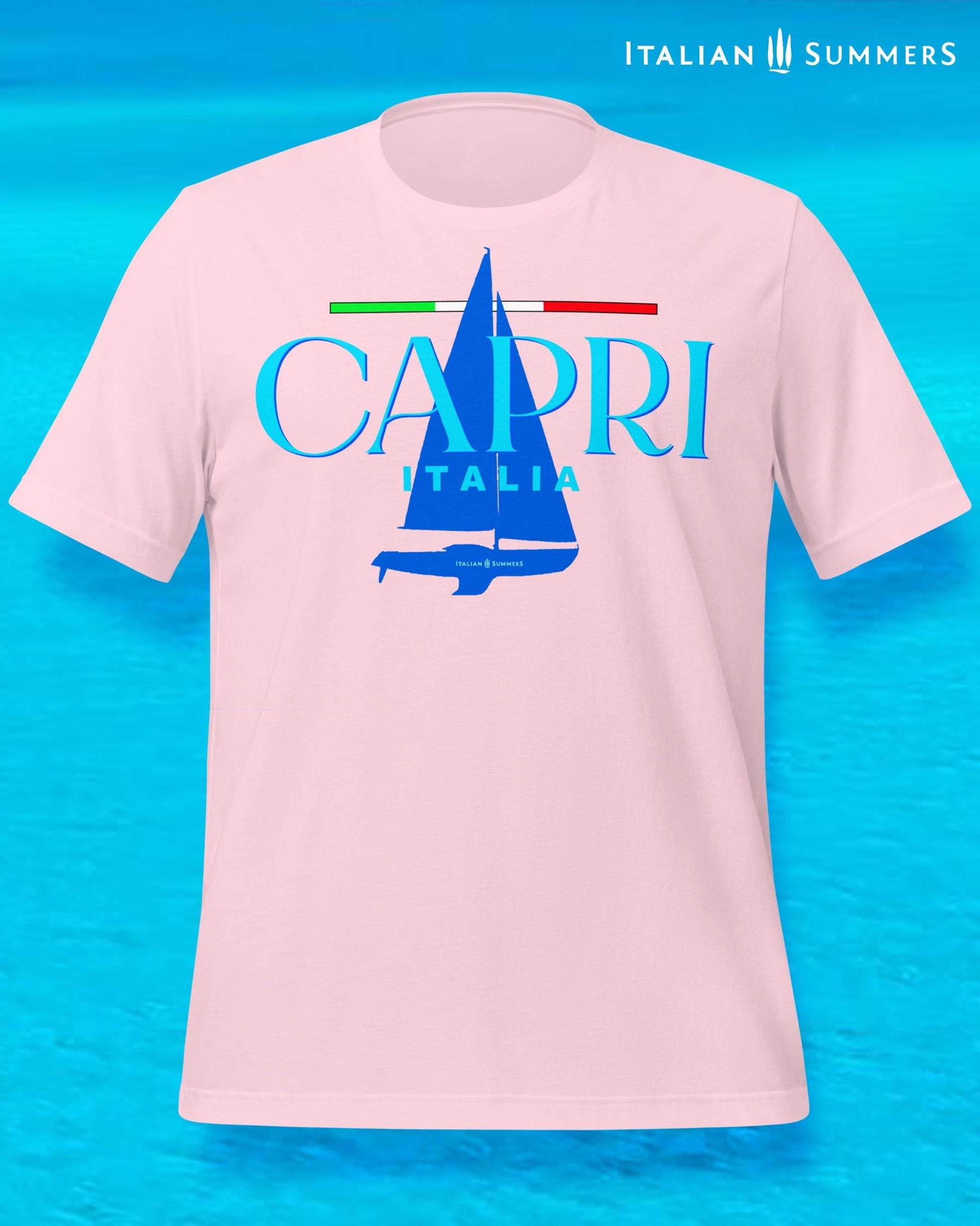 A light pink T shirt with a frontal print featuring a marine blue silhouette of a sailboat and a large text: CAPRI, ITALIA, with a thin Italian flag as a chevron, looking like a sailing shirt for sportsmen or Mediterranean Sea enthusiasts.