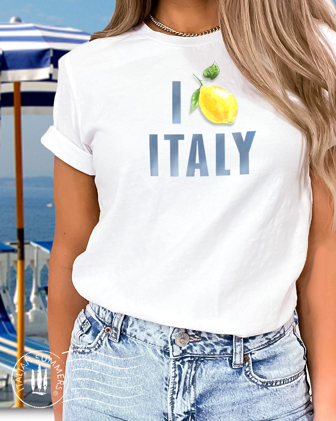 Italy Inspired white cotton unisex T shirt with the watercolored blue text : I Love Italy" where the word Love is symbolized by an Amalfi Coast lemon instead of a red heart. Made by Italian Summers