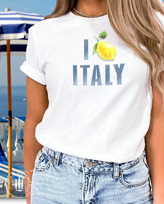 Italy Inspired white cotton unisex T shirt with the watercolored blue text : I Love Italy" where the word Love is symbolized by an Amalfi Coast lemon instead of a red heart. Made by Italian Summers