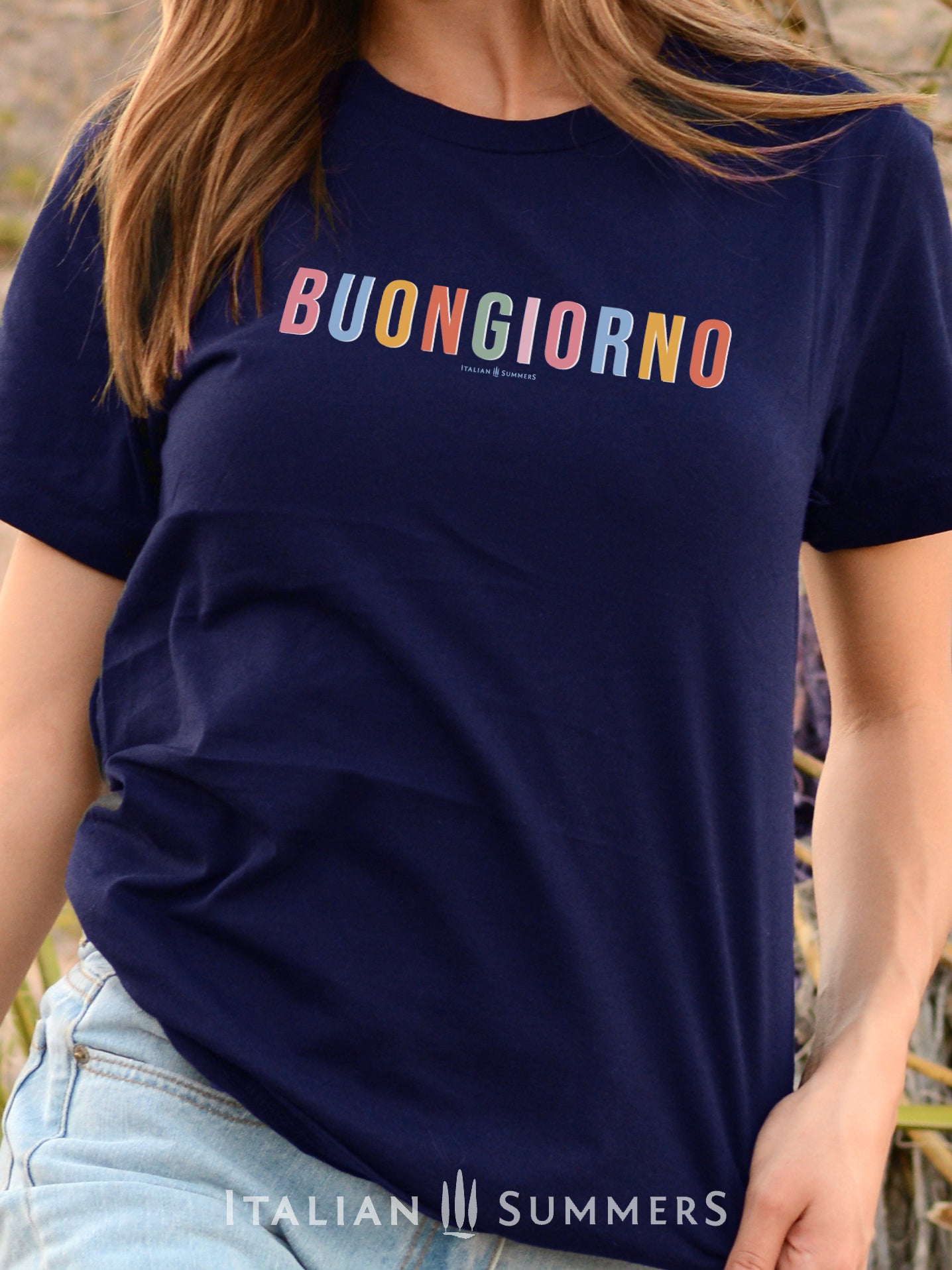 Itay inspired  white cotton T shirt with the Italian phrase " Buongiorno" printed in different soft pastel colors for each letter. A  subtle but stylish way to both wink at all Italy-lovers and to give a nice positive greeting to whomever reads it.