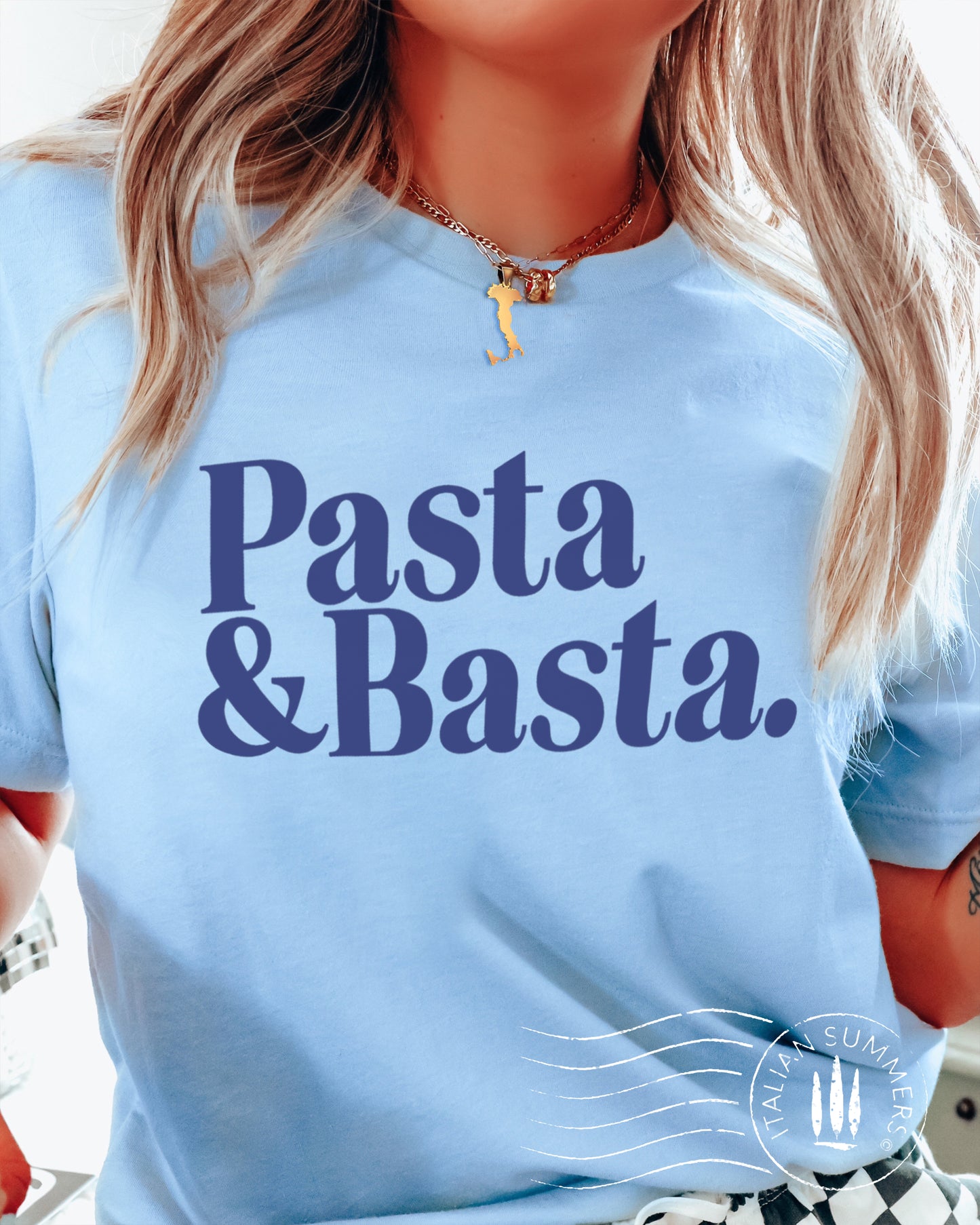 A girl is wearing a lItaly-inspired light blue Unisex crew neck T shirt with a large retro text: Pasta & Basta.