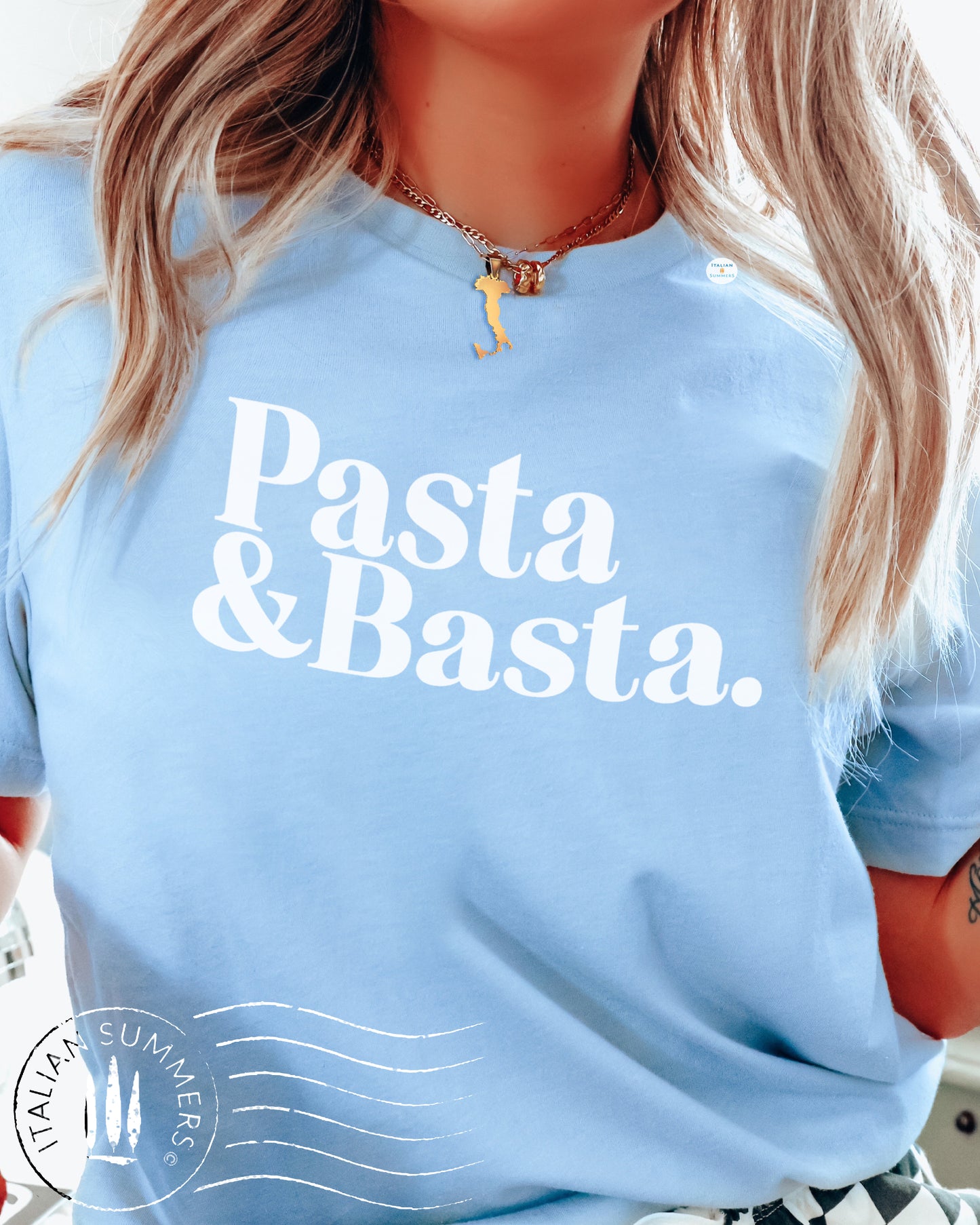 A girl is wearing an Italy-inspired light blue Unisex crew neck T shirt with a large retro text: Pasta & Basta.