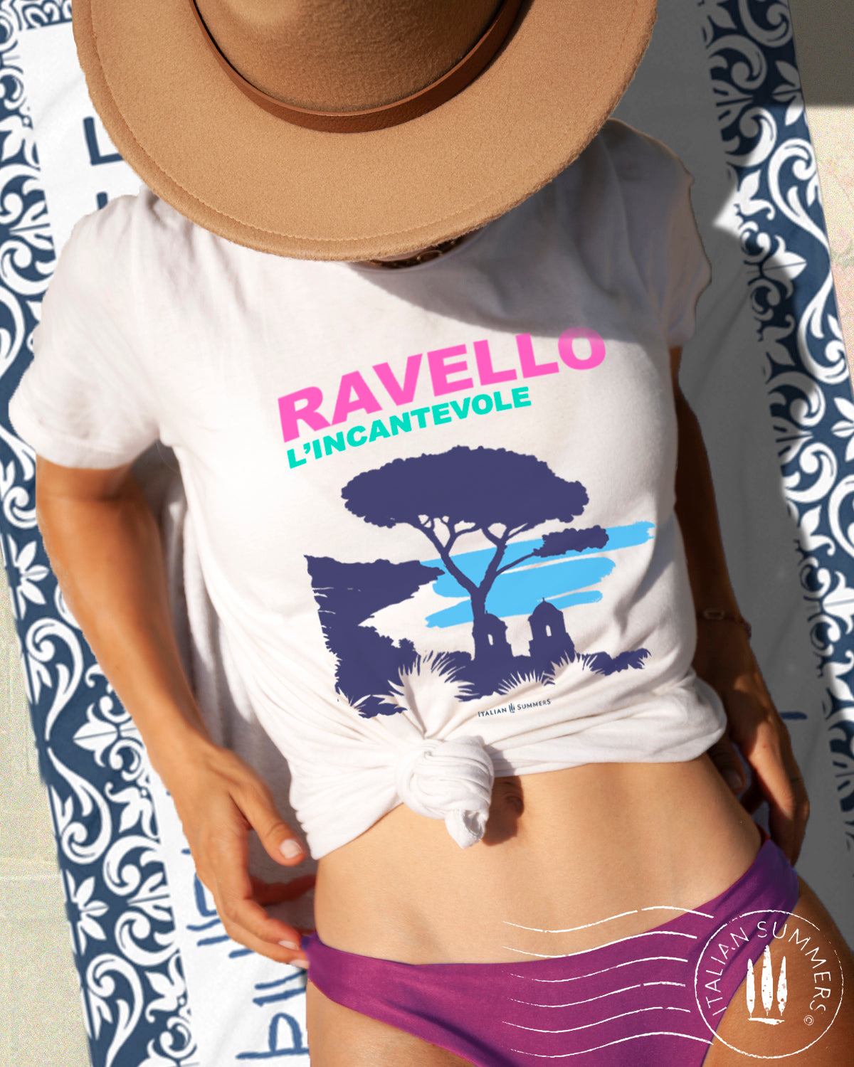 Italy-inspired garment dyed T shirt with a print of the Amalfi Coast location of Ravello with the quote of "Ravello, l'incantevole" Ravello the enchanting. Made by Italian Summers