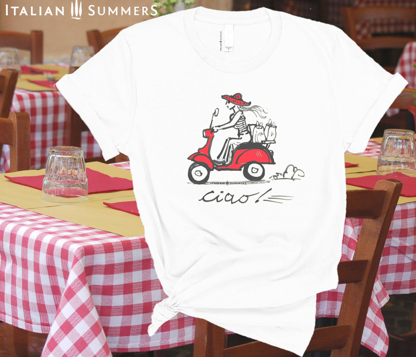 Italy-Inspired white T shirt VESPA CIAO, features a print of our original handpainted design of a fashionable girl with a big summer straw hat speeding through an Italian town with shopping bags on a vintage red Vespa.