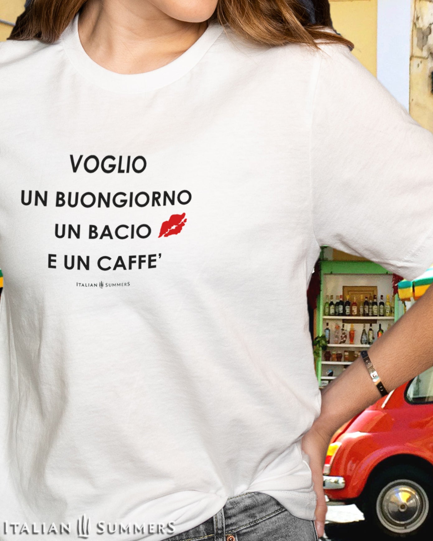 Itay inspired white cotton crew-neck unisex T shirt  with the Italian phrase: "Voglio un Buongiorno un Bacio e un Caffe'"  (I want a good-mornig, a kiss and a coffee)   with a red kiss stamped on the left chest