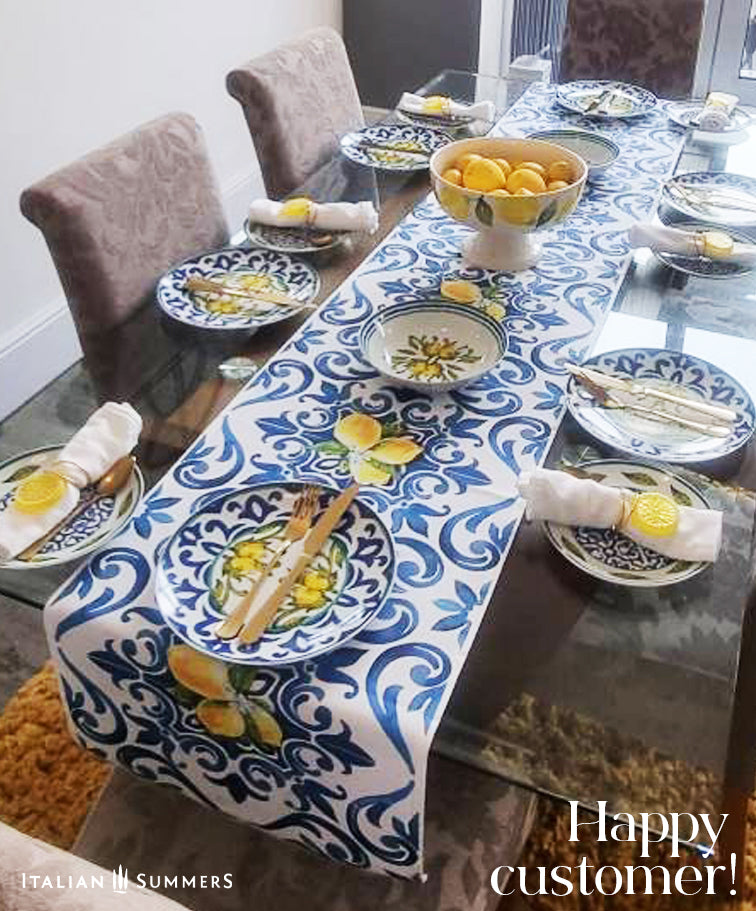 Italy inspired table runner printed with a blue and white pattern  of  Italian maiolica tiles and bundles of Sorrento lemons with flowers. A true Amalfi Coast decorational touch to any diningroom. Made by Italian Summers.