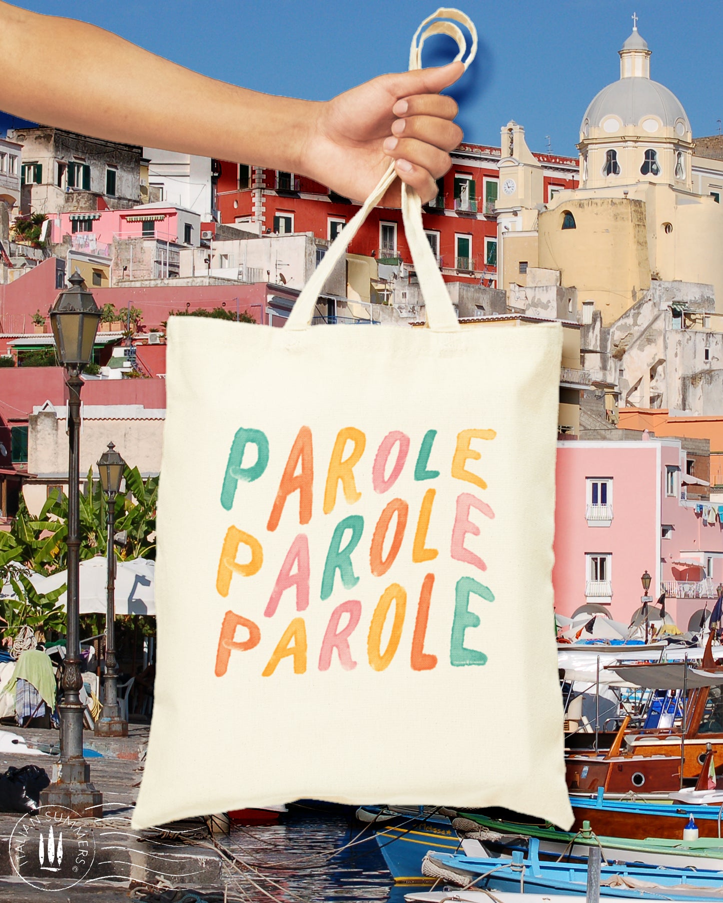 A happy-looking Natural Cotton Tote bag with the Italian quote 'Parole Parole Parole, printed with hand-brushed multi-colored letters. Perfect for the beach, shopping or just a stroll in the Piazza.