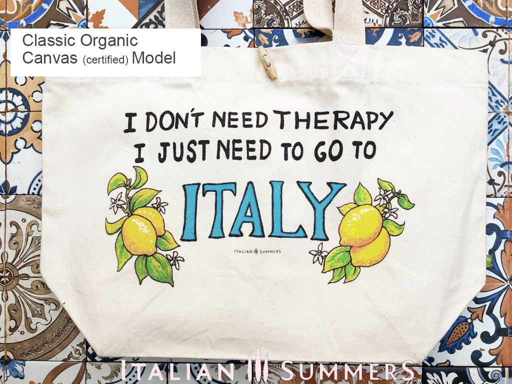Tote bag with the quote " I don't need therapy, I just need to go to Italy " .The quote is flanked by Amalfi lemons with flowers. Designed and sold by Italian Summers