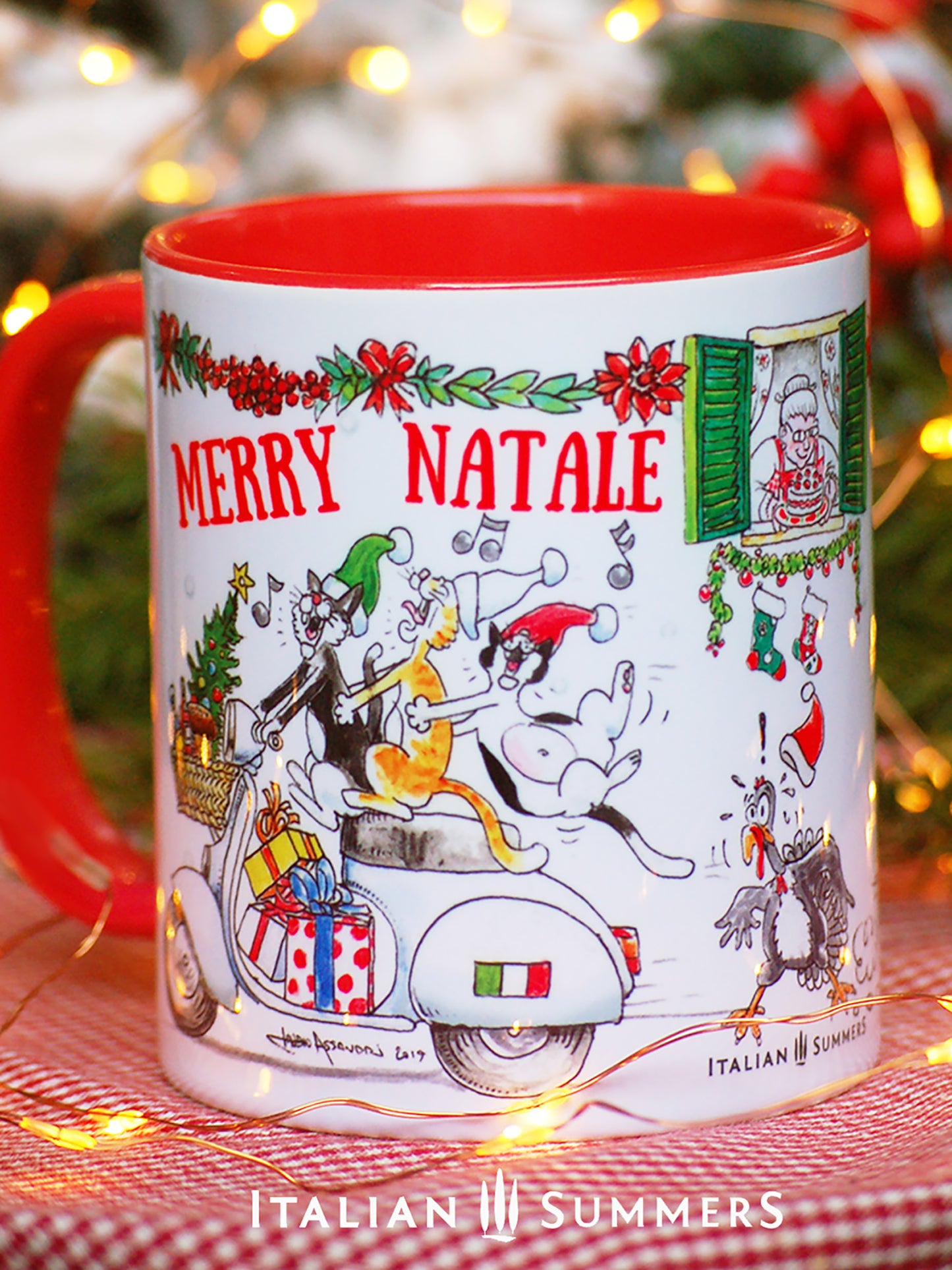 This Italy-inspired ceramic Christmas mug features the print of a merry trio of Italian cats singing carols on a vintage Vespa as they speed through an Italian street. A cute vintage red Fiat500 car zooms in the opposite direction with a Christmas tree on the roof!
