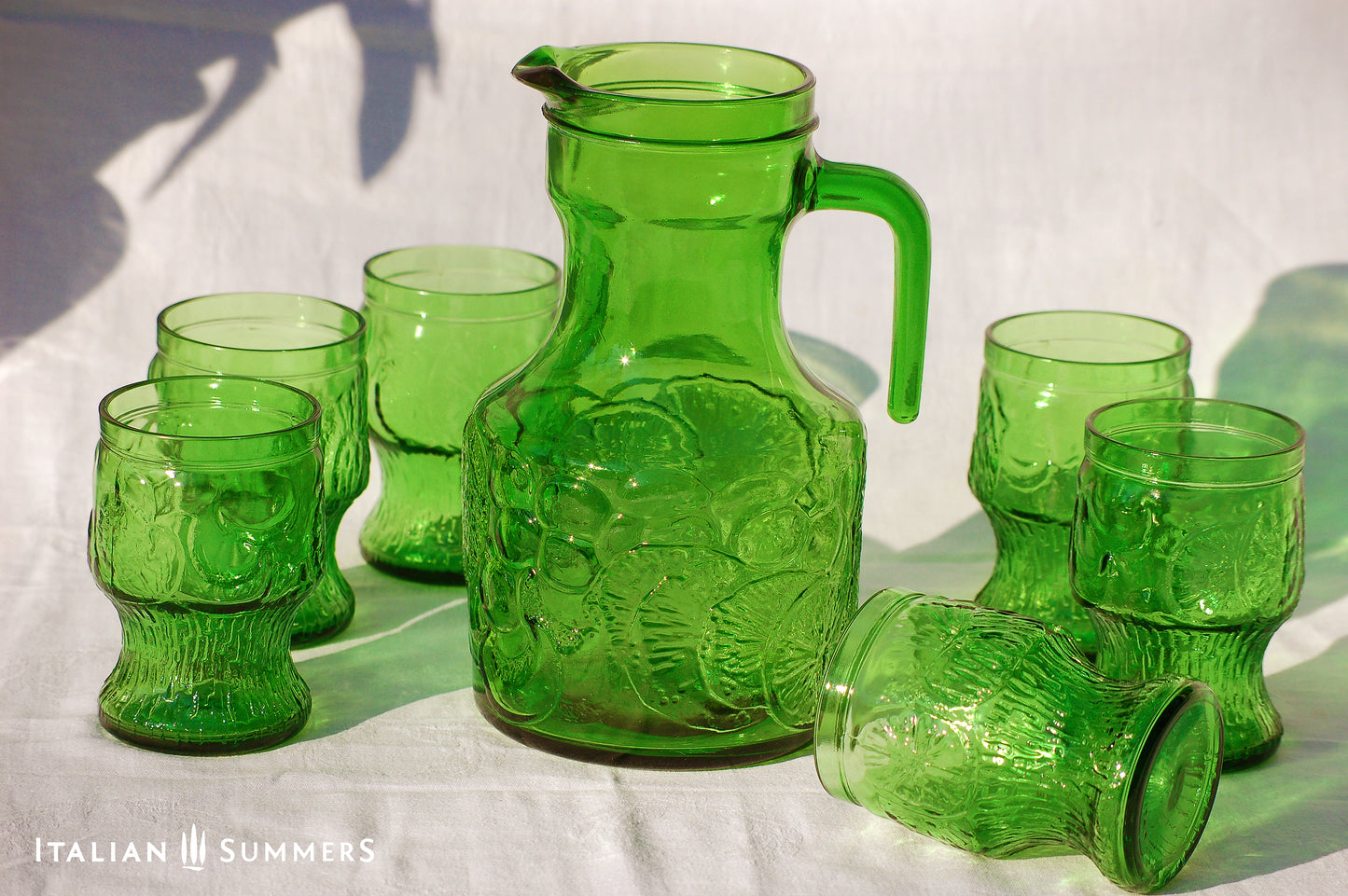 Italy vintage green glass set by Bormioli with embossed Lemon slices, 6 tumblers and a carafe by Italian Summers