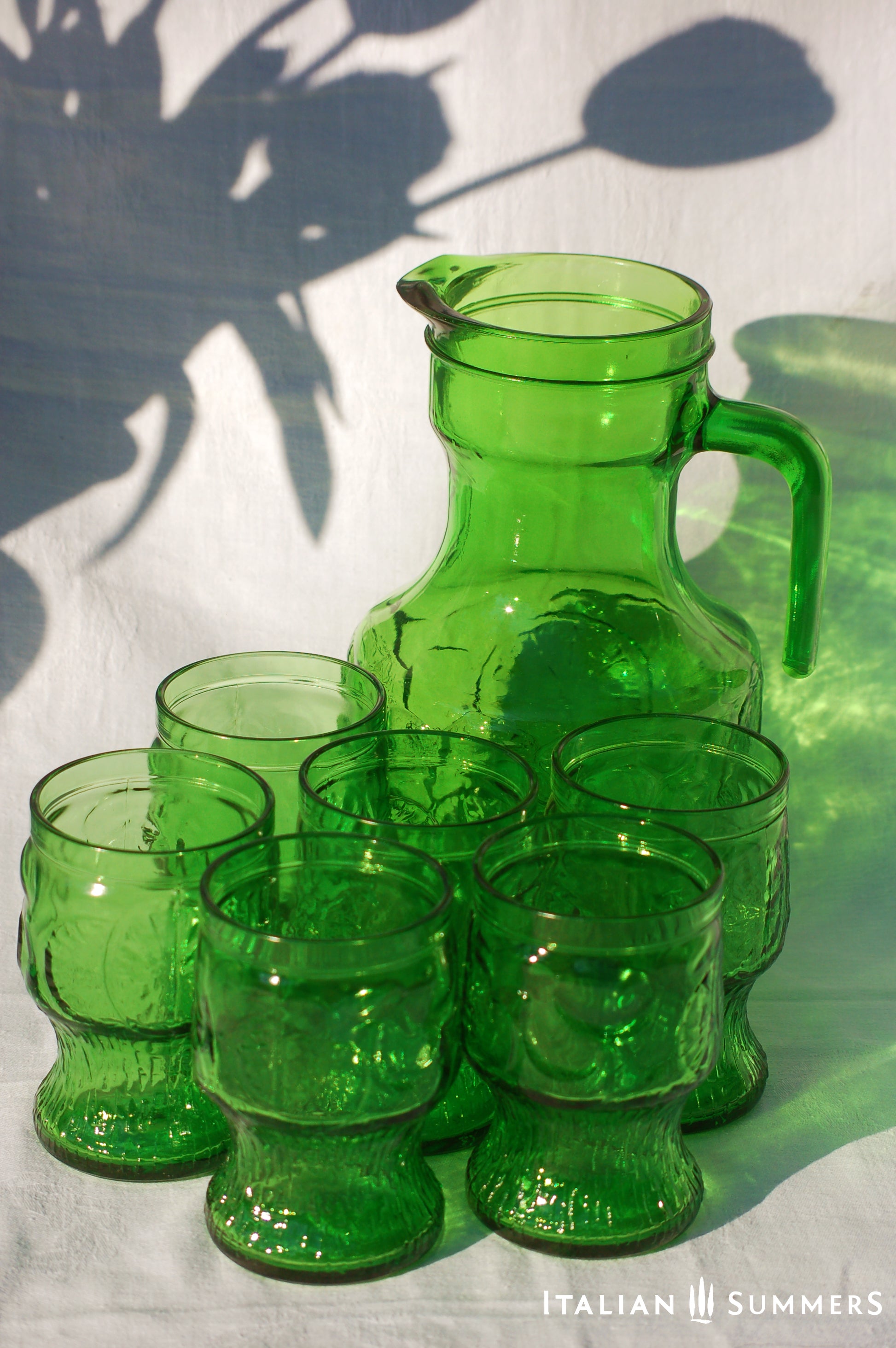 Italy vintage green glass set  by Bormioli with embossed Lemon slices, 6 tumblers and a carafe by Italian Summers