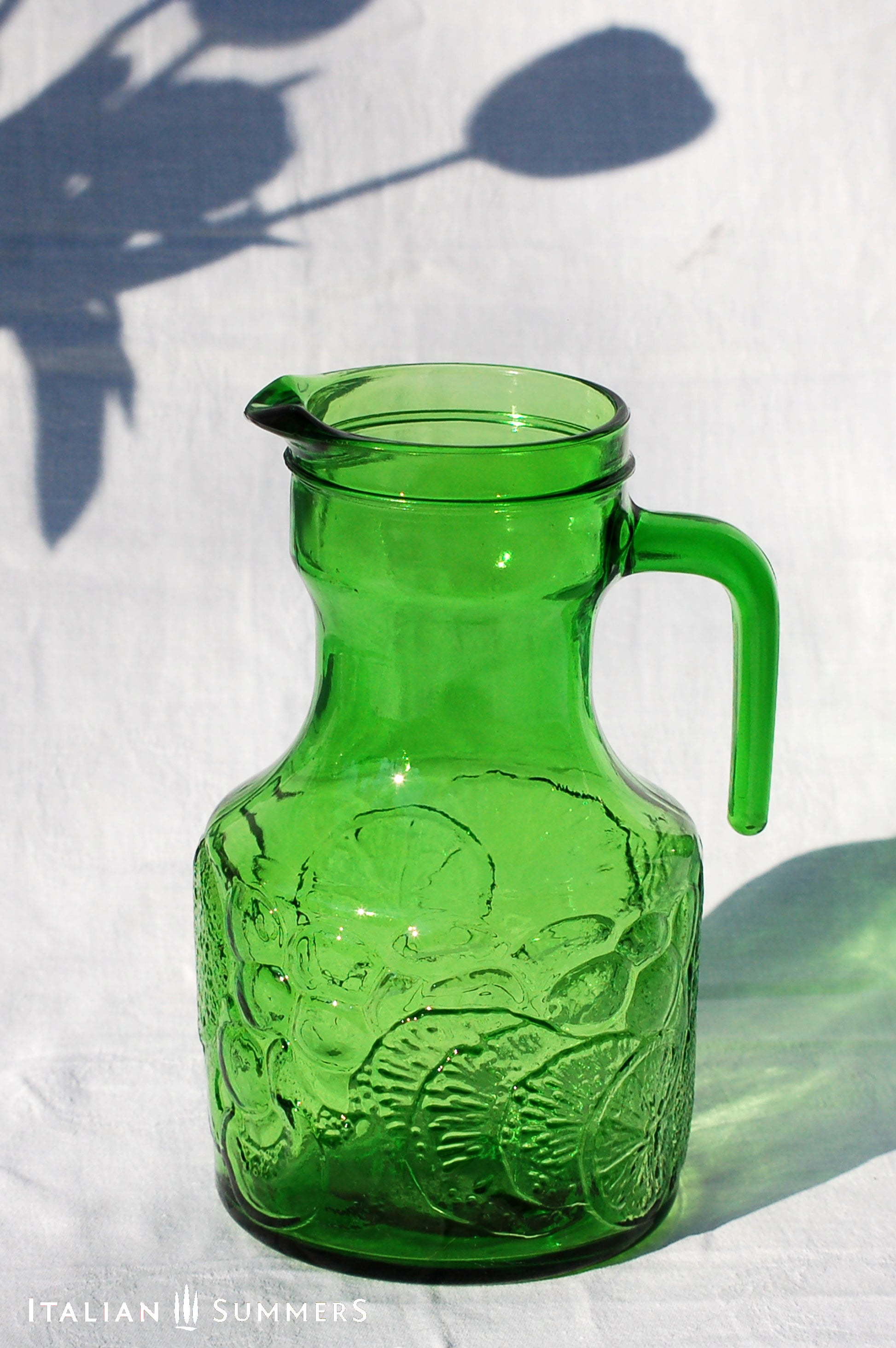 Italy vintage green glass set  by Bormioli with embossed Lemon slices, 6 tumblers and a carafe by Italian Summers
