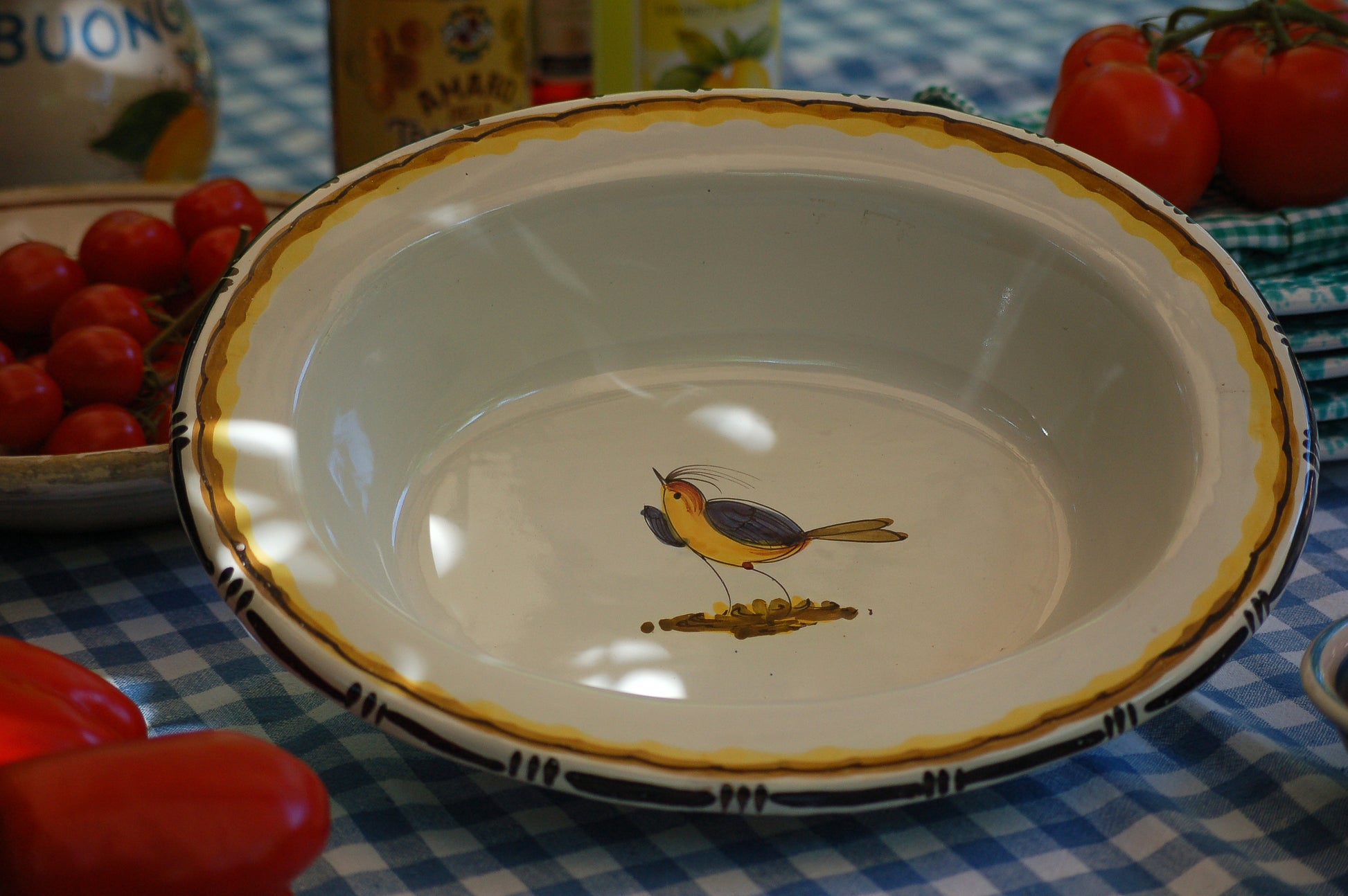 Vintage_ceramic_serving_plate_with_hand-painted_bird_in_the_center_from_Tuscany for Italian Table setting