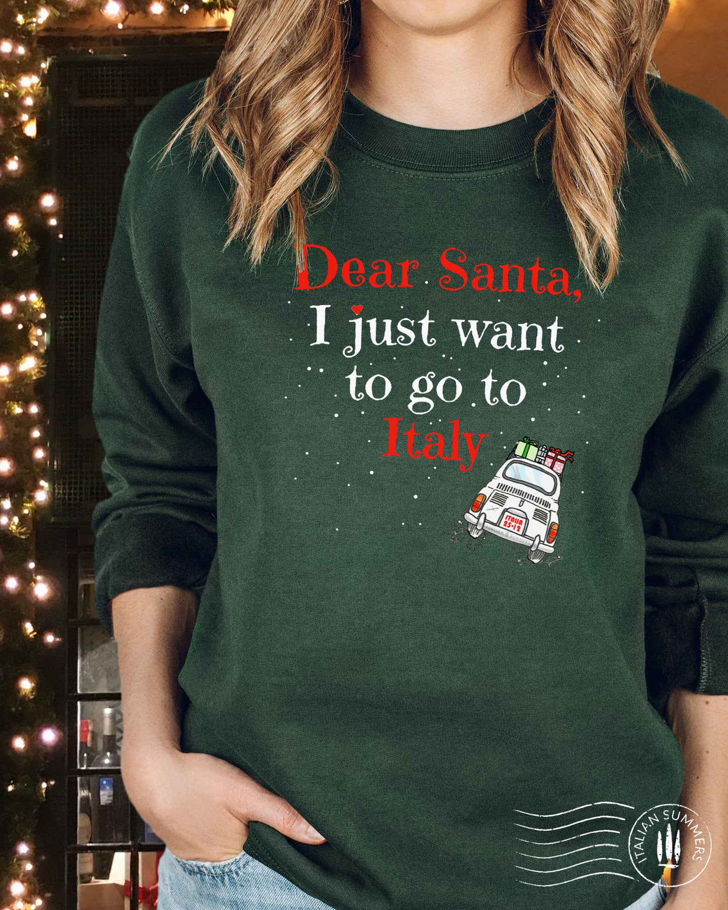 A soft, comfy and cozy Italy-Christmas inspired sweatshirt. It features the fun phrase: "Dear Santa, I just want to go to Italy", and a vintage Fiat 500 speeding away loaded with wrapped Christmas gifts: Buon Natale!