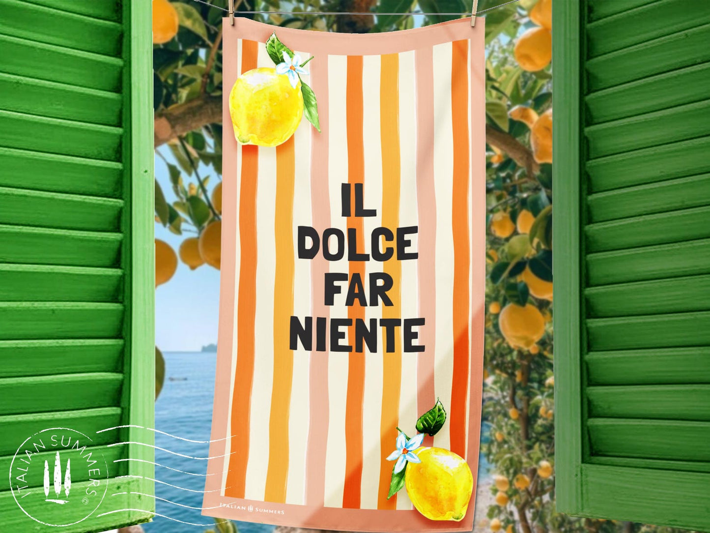 A retro-inspired Italian beach towel with pink and orange watercolor stripes, the phrase “Il Dolce Far Niente,” and two bright lemons in the corners—ideal for quick drying and an Italy vacation.