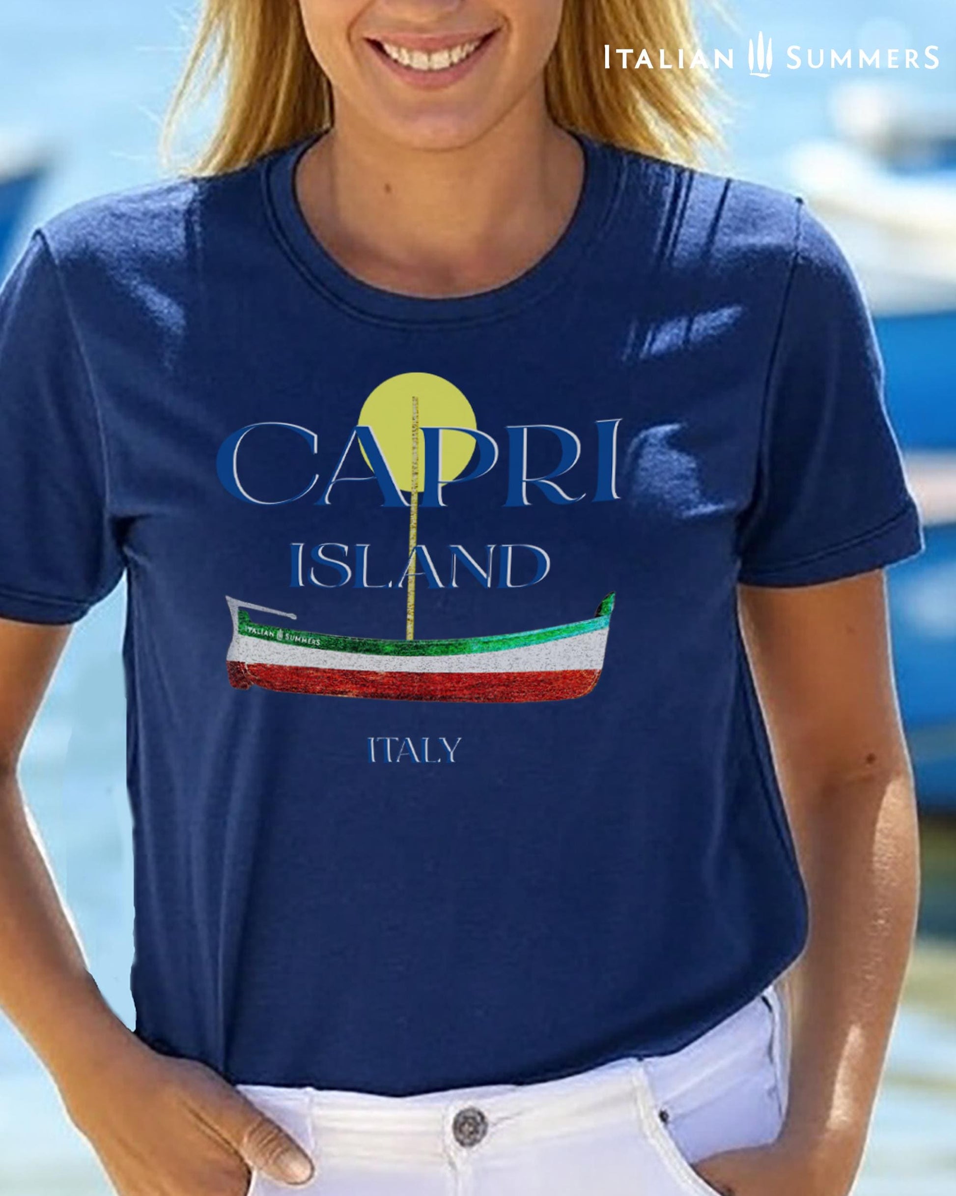 A Garment-dyed quality Navy-Blue  T shirt with a print of a traditional Capri Island wooden boat in the color of the Italian flag, and the text CAPRI in capital letters above it, with a full-moon disk above.
