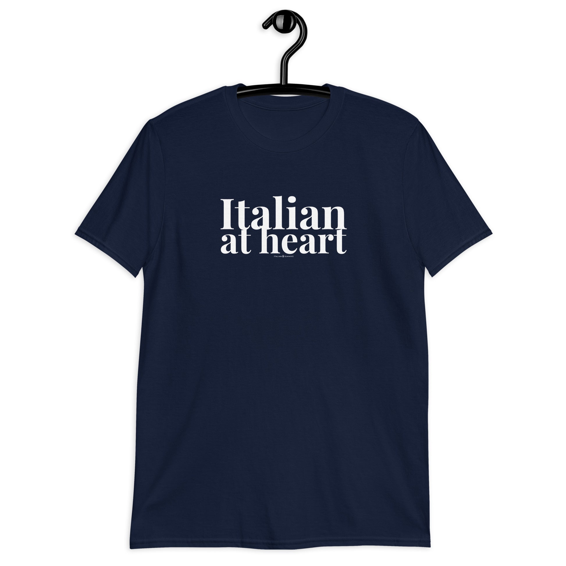 A girl wears a navy blue all cotton t shirt with a retro-style white text print that states: ITALIAN AT HEART