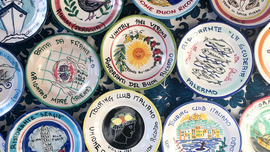 A collection of authentic Italian vintage restaurant plates called Buon Ricordo plates.