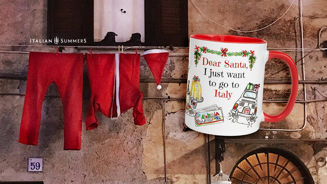 Italian Christmas mug “Dear Santa, I just want to go to Italy” in front of a rustic Italian house with Babbo Natale’s clothes hanging outside.