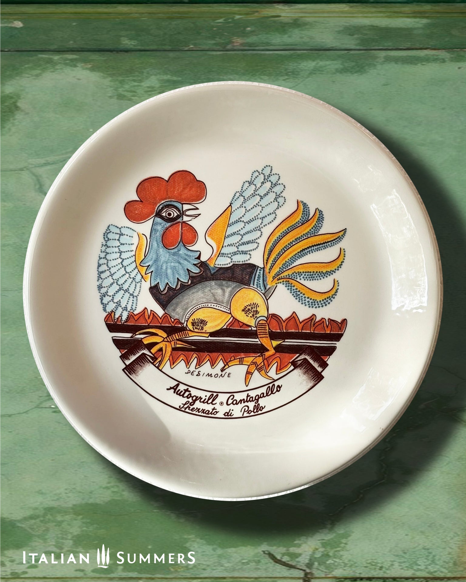 An Italian Vintage ceramic plate with the design by De Simone featuring a stylized rooster, with a cartouche of the name of an Autogrill restaurant and a typical dish of the same.