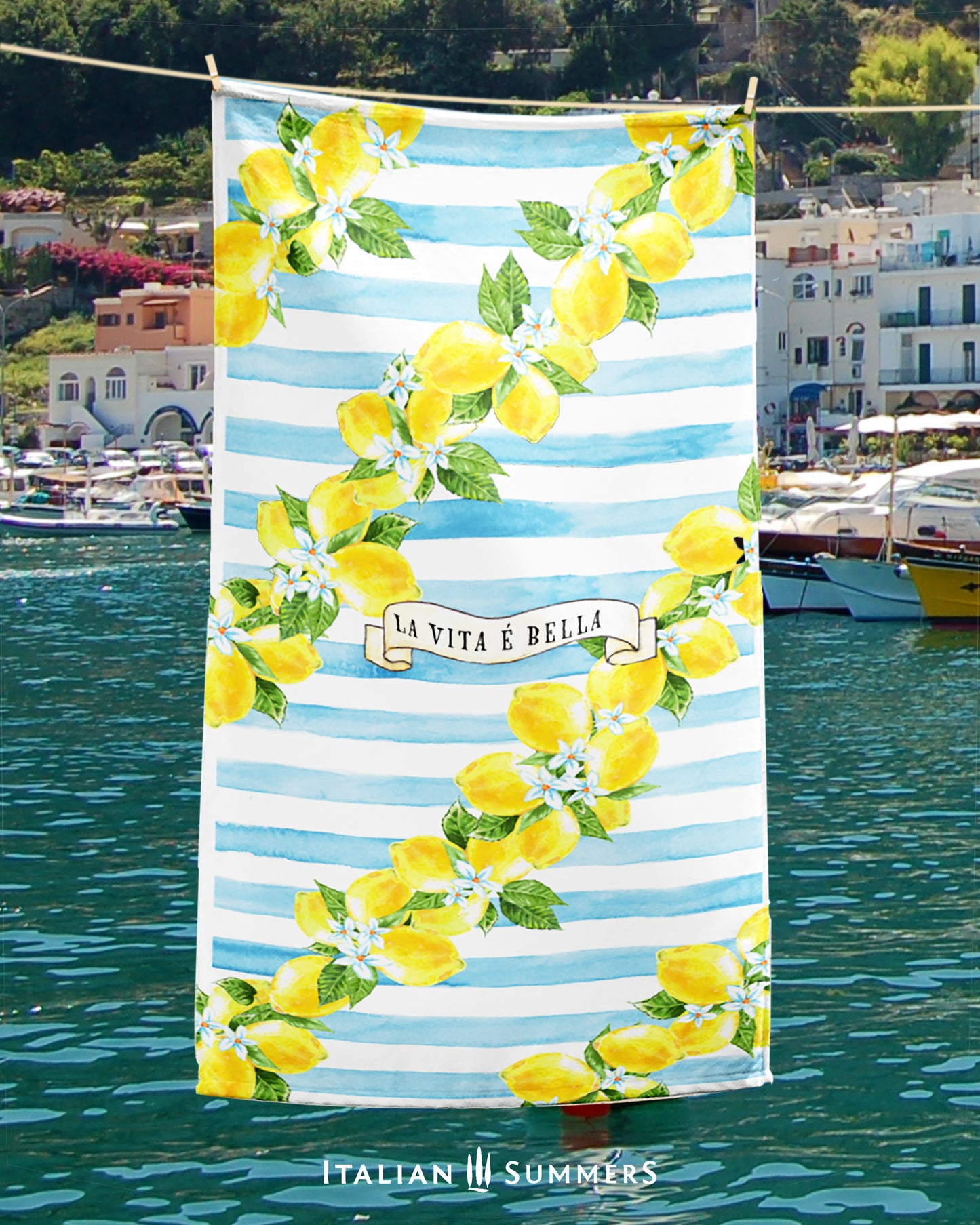 Dive into summer with this delightfully Italian beach towel! With its wreaths of bright lemons against a backdrop of light blue stripes, its cute design screams 'la vita 'e bella!' - perfect for Italy lovers, travelers, and anyone looking for a slice of the Amalfi Coast!