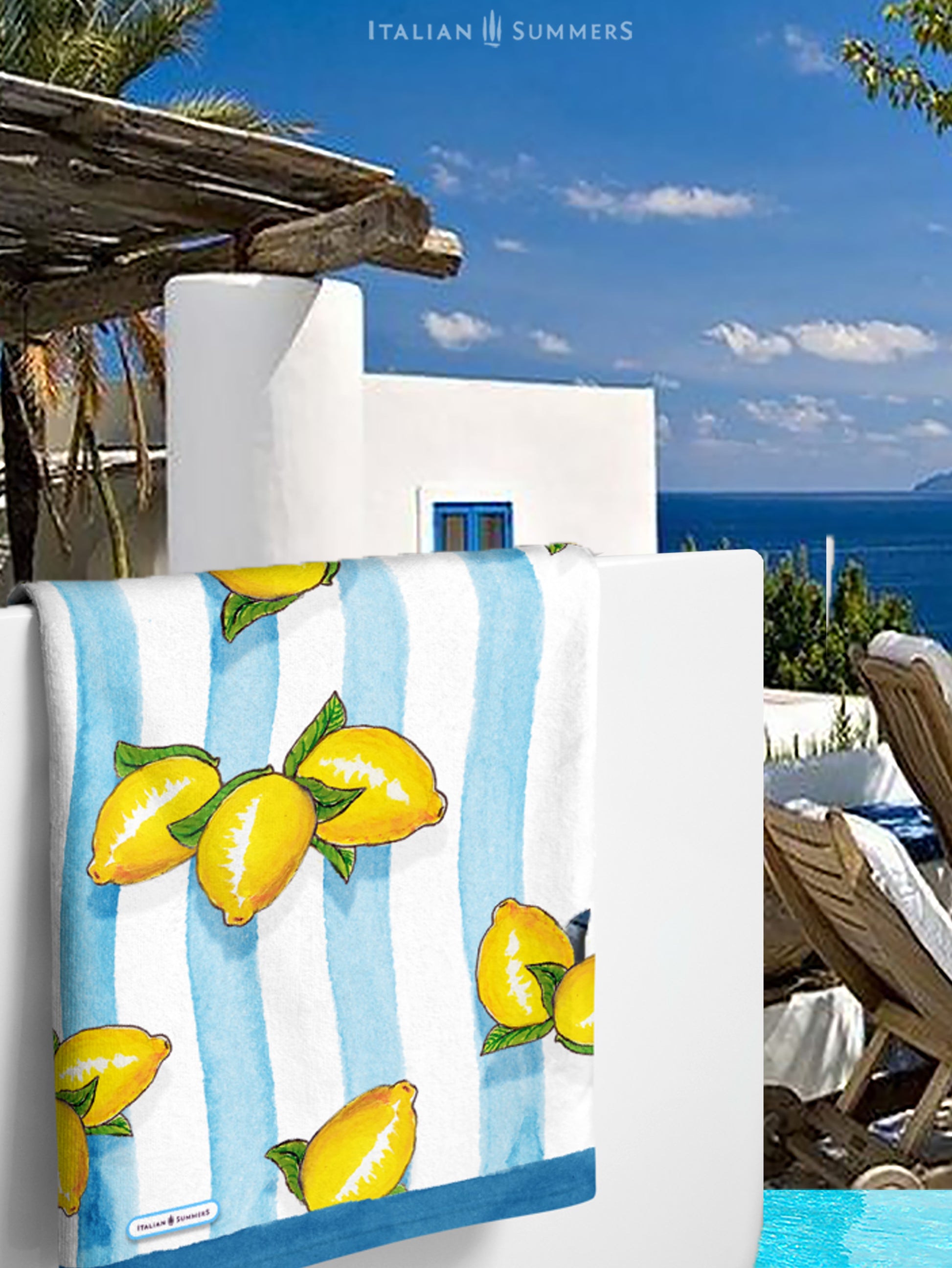 A large beach towel with printed Sorrento lemons on a background of aqua blue water color stripes. A happy and sunny Italian summer feeling. Made by Italian Summers