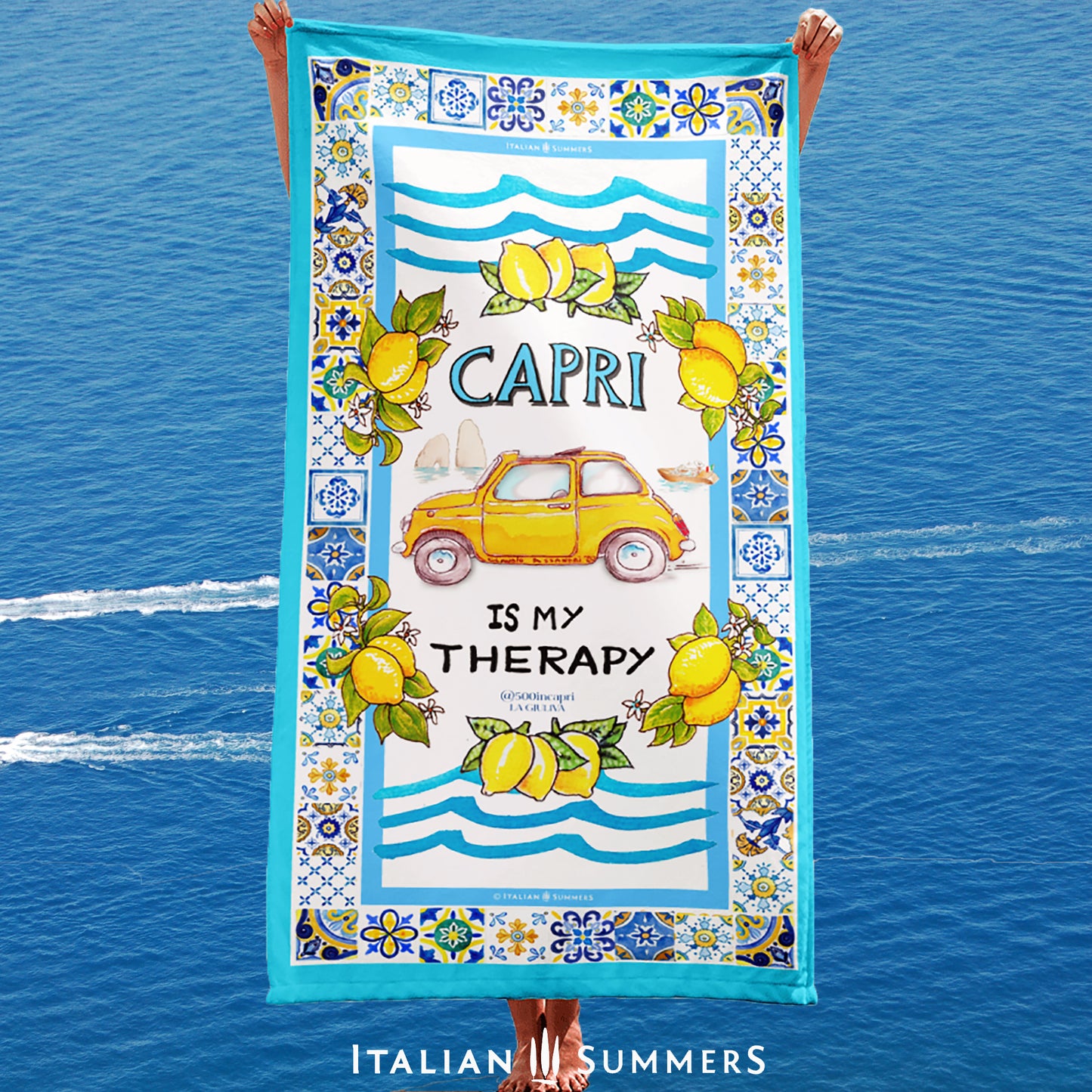 Italy Capri inspired beach towel printed with a frame of colorful italian maiolica tiles  around a vintage yellow FIAT 500 car  parked on an overlook by the famous Faraglioni. Made by Italian Summers